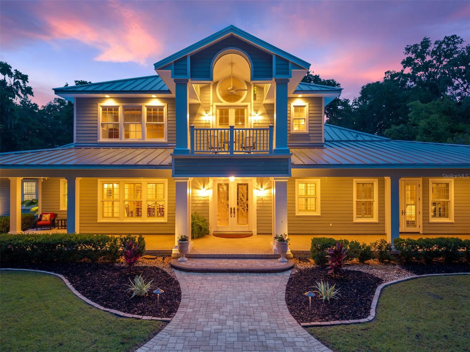 Exquisite Gated 10-Acre Oak-Lined Estate near UF & I-75
Discover unparalleled luxury and privacy in this magnificent 4-bedroom main residence featuring a dedicated movie room, a spacious detached garage with an in-law/guest suite above, and a sprawling pool & spa set within beautifully landscaped grounds. Situated behind grand gates and framed by majestic oak trees, the estate offers dual entrances for exclusive access.
Step inside through a dramatic foyer with soaring ceilings and natural light pouring in from the cupola. The great room, anchored by a striking stone fireplace, flows seamlessly to the kitchen and outdoor entertaining areas. A stunning bar with ice maker, beverage fridge, and sink is perfectly positioned for gatherings and cinema nights.
The chef’s kitchen is a dream—with double ovens, gas cooktop, warming drawer, Sub-Zero refrigeration, roll-out shelving, a prep sink, and an expansive pantry, this space is as functional as it is elegant. On the main level, the luxurious owner’s suite offers French doors to the patio, a versatile pocket office ideal as a nursery or craft room, an oversized mirrored walk-in closet, and a spa-inspired bath with separate tub and glass-enclosed shower—creating a private retreat.
Upstairs features a generous loft, two large bedrooms, and a bonus room with custom built-ins and private bath—perfect for a fourth bedroom and abundant storage.
Outside, the estate dazzles with resort-style amenities: a large screened pool & spa, summer kitchen, private orchard, lean-to pole barn, fire pit, trampoline, zip line, plus a detached 3-car garage (one bay RV-height) with workshop and bonus suite above. Relax on the wrap-around front porch overlooking a serene pond, or entertain on the expansive rear patio.
Enjoy the peace of 10 acres with modern convenience—minutes from UF/UF Health, I-75, shopping, and dining—while nestled in a truly rare, hidden-gem gated enclave in Gainesville.