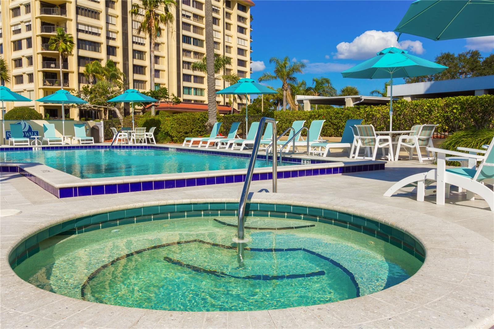 Available Aug 1st - Experience luxury island living at its finest in this exquisite condo boasting captivating views from each room that will leave you breathless. Start your day by sipping morning coffee on the expansive balcony overlooking Clearwater Beach and the Gulf of Mexico. This large 1-bedroom, 1.5-bathroom retreat was remodeled to open up the kitchen and maximize space. Step into a fully furnished interior, tastefully decorated and stocked with everything you need for the ultimate Florida living. The master suite features a king-size bed, smart TV, and a vast walk-in closet, ensuite bath with double sinks, a spacious shower area, and balcony access complete the space. Island Walk is a true resort-style community that offers waterfront amenities including a pool, hot tub, tennis & pickleball courts, grills, and picnic areas, as well as a boardwalk along the intra-coastal. One reserved covered parking space and ample guest parking spots add peace of mind and convenience. Island Estates is a self-contained waterfront paradise of Clearwater Beach offering fine dining, Publix Grocery store, Sushi, Market /Deli / ice cream shop, Windward Bar & Grill, Coffee shop, UPS Store, 2 Nail Salons, Dry Cleaner, Gas Station with auto repair and Clearwater Marine Aquarium! Just a short walk, bike ride or Jolley Trolley ride over to the consistently top ranked Clearwater Beach. With proximity to Tampa, and central Florida attractions, plus quick access to Tampa and St. Pete/Clearwater airports, this location truly embodies the Florida beach life.