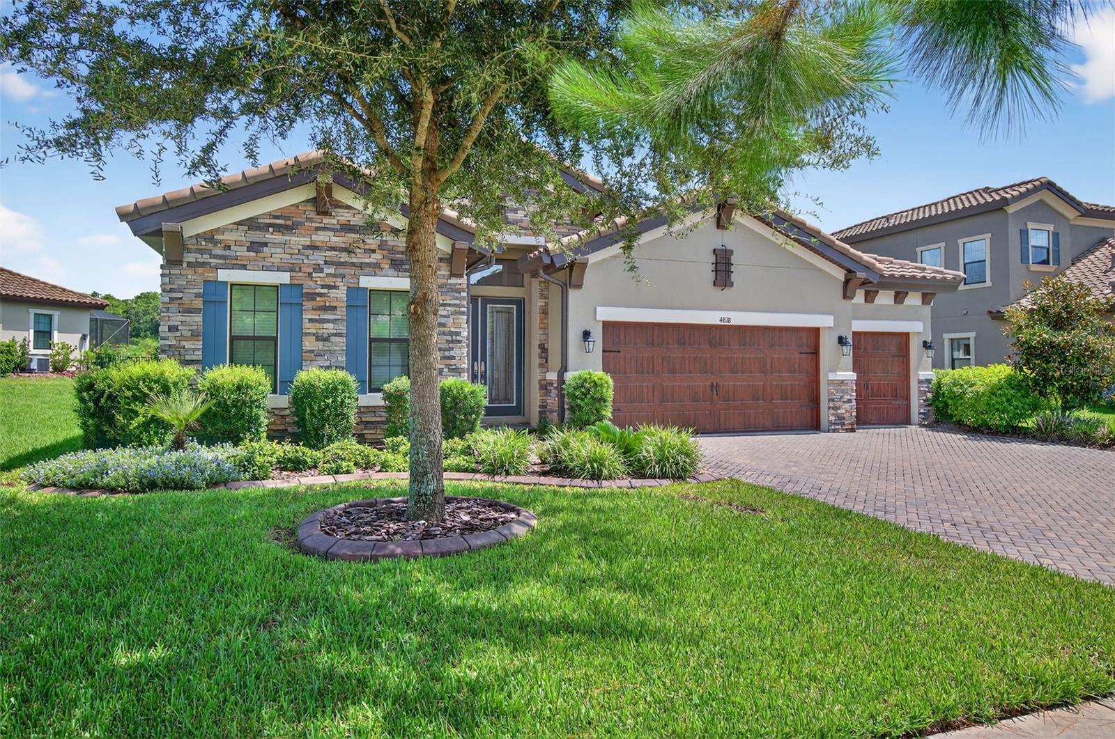 WHAT A BEAUTY!! Exquisite Home in Gated Starkey Ranch - ANCLOTE RESERVE – Move-In Ready Oasis with Stunning Conservation Views! Welcome to your dream home nestled in the desirable gated community of Starkey Ranch, where elegant design, modern comforts, and serene, natural surroundings come together seamlessly. The spacious, open-concept layout with a split floor plan is enhanced by soothing neutral tones and warm finishes, creating a welcoming and comfortable environment throughout. The luxury vinyl plank flooring and eight ceiling fans throughout the home enhance both comfort and style. The smartly designed layout features a large master suite, a dedicated office/4th bedroom with a stylish barn door, and a thoughtfully designed living area perfect for everyday living and entertaining. As a bonus, the sellers are leaving behind a beautiful billiards table—ready for your enjoyment from day one. The gourmet kitchen boasts ample counter space, an oversized island, solid wood cabinetry, a gas cooktop, separate beverage refrigerator and a built-in dining table—perfect for entertaining guests or enjoying casual family meals. Step through the back wall of glass sliders into your covered, screened lanai boasting a saltwater pool and spa, where indoor and outdoor living merge effortlessly. Take in the stunning conservation and pond views, framed by natural Florida landscape and wildlife. Relax in your private hot tub, with the added convenience of a full bathroom and shower just steps away on the lanai. With a custom outdoor speaker system and trim lighting controlled by app, this backyard oasis is ideal for entertaining or peaceful unwinding. Additional highlights include —Three-car garage with ceiling mounted storage racks, Brick paver driveway, and Hurricane shutters for added peace of mind. As a Starkey Ranch resident, you’ll enjoy access to three sparkling community pools, a clubhouse, parks, and more—all designed to enrich your Florida lifestyle. This home is in pristine, move-in ready condition—offering the perfect blend of luxury, comfort, and natural beauty. Schedule your private tour today!