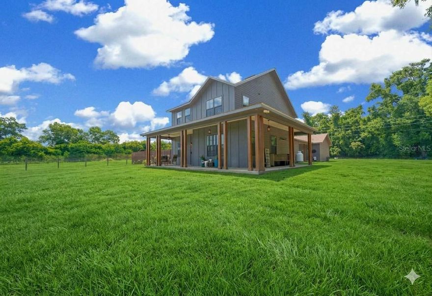If you've been dreaming of a peaceful retreat that still keeps you close to everything you need, this beautiful two-story farmhouse might be just what you're looking for! Bring your horses and settle into a property less than four years old, ideally situated near I-75 and only a quick 15-minute drive to Gainesville. The property line is surrounded by mature trees, providing a wonderful sense of privacy and serenity that’s hard to find in the city.


Step inside, and you'll be greeted by soaring 9-foot ceilings and light oak laminate flooring that flows throughout the main living areas on the first floor, creating a bright and welcoming atmosphere. The kitchen is a chef’s delight, featuring a spacious walk-in pantry, stylish two-tone cabinetry, and stunning quartz countertops. The open-concept dining and living area ensures you’ll have plenty of space for both daily living and entertaining guests.


The primary suite is conveniently located on the first floor, complete with a generous en-suite bathroom featuring a relaxing soaking tub and a walk-in closet. There’s also a dedicated office space that makes working from home both practical and comfortable.


Upstairs, you’ll find two sizable bedrooms, each offering their own en-suite full baths and walk-through closets, giving everyone privacy and storage space. There’s also a large bonus room on the second story, which can be easily tailored to your needs—whether you envision a game room, media room, weight room, or something else entirely.


Outside, you can unwind under the breezeway sitting area or enjoy the beautiful porch that wraps halfway around the house, perfect for soaking in the peaceful surroundings. This location is incredibly convenient to stores, riding trails, schools, and so much more.

*24'x48' pole barn for stalls or your storage needs*

Don't miss the chance to experience this unique blend of modern comfort, privacy, and convenience. If you’d like to schedule a tour please give me a call!