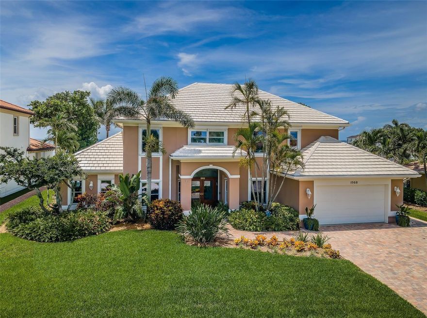 LOCATED IN ONE OF TAMPA BAY’S PREMIERE WATERFRONT COMMUNITIES, CLOSE TO EXCEPTIONAL PRE-K – 12 SCHOOLS, AND NEAR DOWNTOWN ST. PETE, THIS WONDERFUL COASTAL WATERFRONT RESIDENCE DELIVERS SPECTACULAR OPEN WATER VIEWS OF TAMPA BAY! Lush landscaping and a fine brick paver driveway introduce a lovely covered double door entry and splendid foyer. Step into the inviting 19ft-high coastal living room and take in fabulous views of Tampa Bay! Your elegant kitchen boasts granite surfaces, glass tile backsplash, coastal white cabinetry, an excellent island prep center, and a sizable matching built-in work desk. Casual waterfront dining is complemented by a graceful formal dining room. The grand waterfront family room with marble-encased fireplace is supported by an impressive all-wood lacquered full-bar with beverage center and seating. The custom designer office, with exquisite cherrywood desk and built-ins, could easily be made a 5th bedroom or den. Your first level guest bedroom suite overlooks the water and opens to the pool deck, with a full bath that opens directly to the pool deck as well. Upstairs rests the superb owner’s suite with spacious sitting area and rich layered ceilings; step out to its wide 225sqft covered balcony and take in commanding, panoramic views of Tampa Bay. Your owner’s bath enjoys dual vanities, a dedicated cosmetics center, a marble-encased Jacuzzi soaking tub, an all-marble glass shower enclosure, and a generous walk-in closet. A very large guest bedroom provides an adjoining full bath. Additional upper-level bedroom suite has considerable closet storage and a full bath with views of the bay. Laundry facility and multi-purpose crafts room with extensive storage complete the upper level. Step out back to an oversized paver deck that surrounds a dazzling swimming pool and spa, all protected a sizable screen enclosure. Deck features a dedicated outdoor dining space and a custom-built grill and bar. Beyond the screen enclosure is a firepit area and an appealing open grassy space that transitions to your wide, update sea wall. This is an outstanding opportunity and the best value in Venetian Isles - 5 bedroom, 4 ½ baths, 4111sqft of living area, with 90ft of seawall on open water! Dimensions are estimates, buyer to verify.