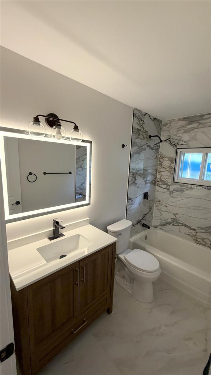 Photo of 328 W Comanche Avenue, Tampa, FL 33604 (MLS # O6453920)