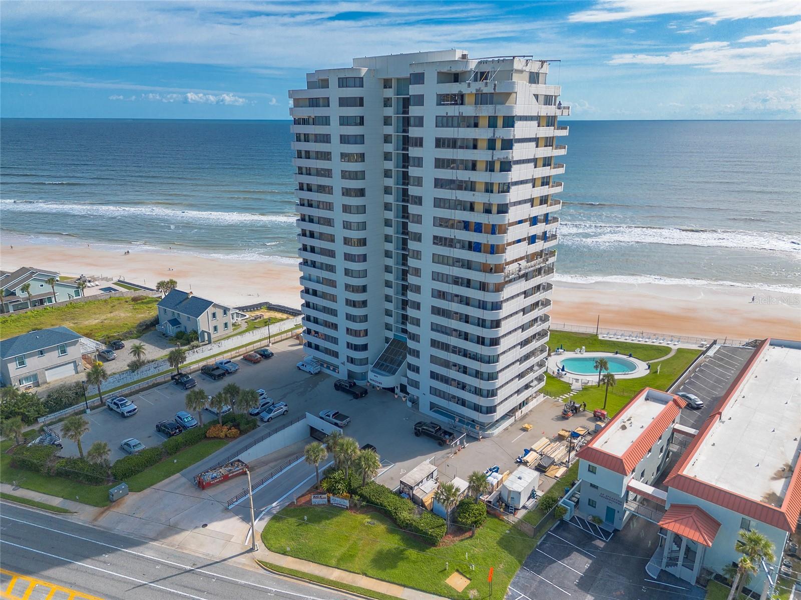 Experience elevated coastal living in this beautifully appointed 3-bedroom, 2-bathroom condominium at Horizons Condominium, located on the 6th floor with sweeping views of world-renowned Daytona Beach. The modern kitchen is a highlight, complete with sleek quartz countertops & a convenient breakfast bar ideal for casual meals or hosting. The spacious living and dining areas flow seamlessly to a private balcony—perfect for relaxing to the sound of the waves and enjoying the ocean breeze. The family room showcases a custom stone fireplace & sweeping ocean views, with seamless access to the balcony—offering an elegant setting for relaxation & entertaining. The primary suite offers a peaceful retreat, with direct access to the balcony, a cozy stone fireplace, and an en-suite bath featuring dual sinks. Two additional guest bedrooms provide ample space, with views of the intracoastal & colorful sunsets. Perfectly situated near premier dining, popular beach spots, and iconic attractions, this property is ideal for personal use or as a strong investment opportunity. Horizons is a condo hotel with the convenience of management on property if you choose to make this a part-time home. Schedule your private tour today and discover refined beachfront living at Horizon in Daytona Beach.