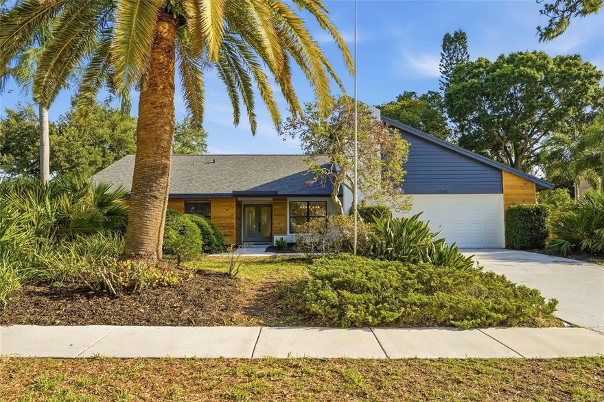 Renovated Pool Home SANCTUARY on Oversized Corner Lot. Beautifully updated and ideally located in highly sought-after Countryside, this former Arthur Rutenberg model home offers 4 bedrooms, 2.5 baths, and over 2,500 sq. ft. of thoughtfully designed living space on a rare .33-acre corner lot tucked into a quiet cul-de-sac. The split floor plan features formal living and dining rooms, a spacious family room with vaulted ceilings, a wood-burning fireplace, and space for a wet bar. Three sets of fully retractable sliding glass doors from the living room, family room, and primary suite open to the sparkling resurfaced screened pool and birdcage, creating seamless indoor-outdoor living. The heart of the home is the designer kitchen, showcasing modern cabinetry, quartz countertops, premium stainless-steel appliances, a breakfast bar, and an island with cooktop—perfect for everyday living and entertaining. Brand-new luxury vinyl flooring flows throughout the main living areas for a fresh, cohesive feel. The serene primary suite offers a large walk-in closet, direct pool access, and a beautifully updated bathroom with a walk-in shower and modern vanity. Additional highlights include an inside laundry room with LG washer and dryer (2013) that convey. Major upgrades include: Architectural shingle roof (2026) 50-gallon water heater (2026) Electrical panel & sub-panel (2026) Wood privacy fence. Resurfaced pool, NEW pool equipment, and new paver patio. Located in a non-evacuation zone with no flood insurance required, this home is zoned for excellent schools and minutes from Countryside Country Club, shopping, dining, beaches, Dunedin, Safety Harbor, Tampa International Airport, and major highways.