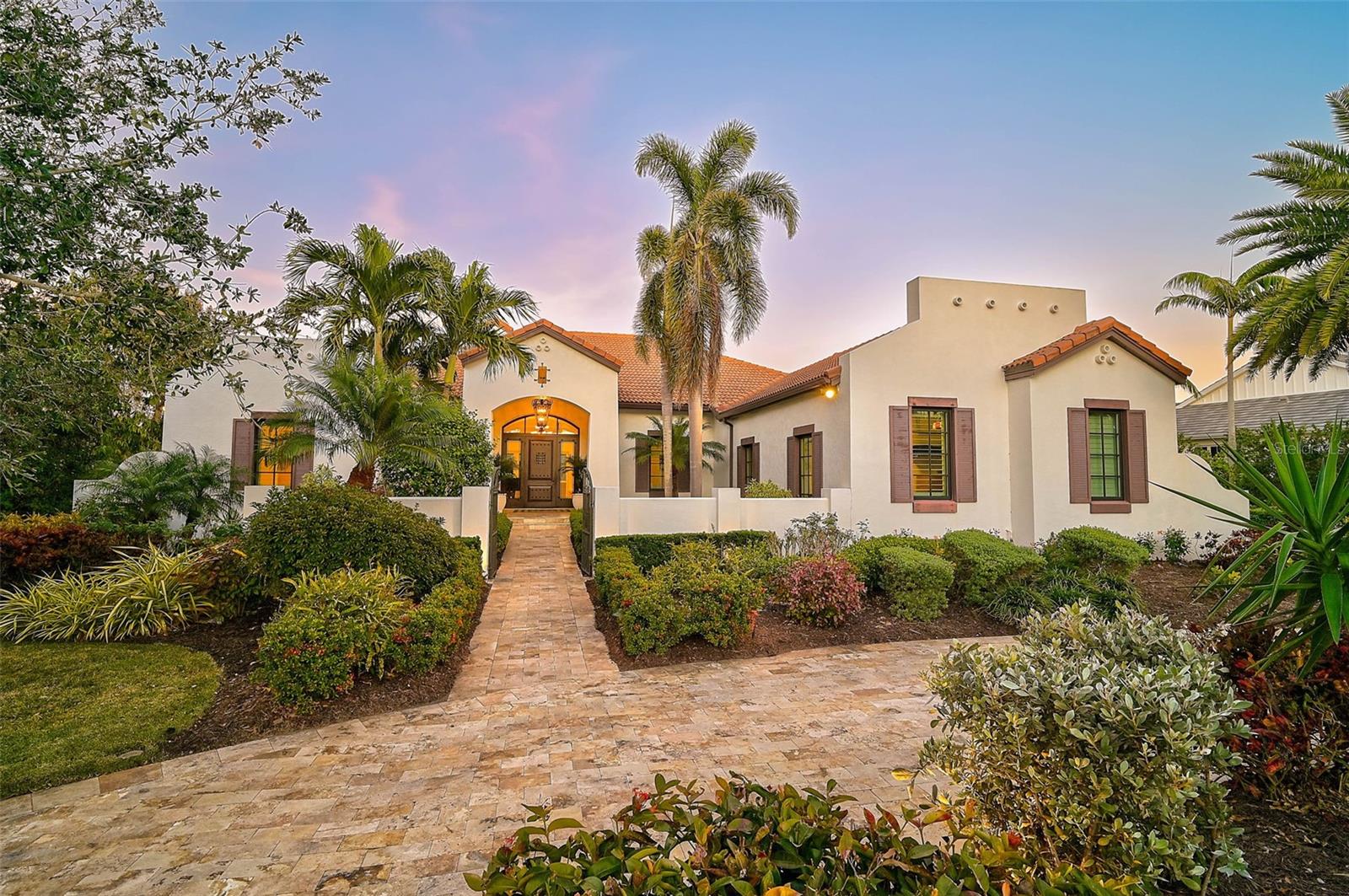 **IMMACULATE ESTATE -- NEWER CONSTRUCTION (2014) -- METICULOUSLY MAINTAINED, MOVE-IN READY, CUSTOM Residence Designed by LAS CASITAS Architects** offers exceptional quality craftsmanship throughout and is located behind the Secure Gates of THE OAKS-BAYSIDE Country Club community. Situated on an Oversized 0.59 Acre Lot backing to a Tranquil, Coastal Preserve and boasting wonderful curb appeal with its manicured landscape, Circular driveway and Courtyard entryway, this Impressive Spanish-style residence features 3-BEDS plus DEN/STUDY (with built in Murphy Bed), 3 FULL and 1 HALF BATHS and a 3-CAR Garage. Premium features abound throughout this Light and Bright, Open Floorplan, including Wood and Marble flooring, Crown Moldings, Tray Ceilings, Custom Built-ins and much more! The sizeable Chef’s Kitchen is a Culinary Dream and features white solid wood cabinets, granite counters, large island with prep sink, counter seating area, premium appliance brands including Thermador, Bosch, etc. The expansive Primary Bedroom suite entails multiple walk-in closets, primary bath with dual vanities and large, custom-tiled shower. Enjoy the utmost in Florida, Outdoor Living in your expansive, screened lanai featuring Heated Saltwater Pool, Outdoor Kitchen, ample covered seating areas and stunning natural surroundings overlooking the Coastal, North Creek Preserve. This “Smart Home” entails Control4 Home Automation, Lutron lighting technology, whole-house water filtration and softener, NEW GENERATOR with 500GAL Propane Tank, Hurricane IMPACT Windows and Doors, 2 Tankless water heaters, etc. THE OAKS is a distinguished, 24hr Guarded, Country Club Community which boasts many accolades including: Platinum Club of America, Emerald Club of the World, Elite Distinguished Club of the World and One of America’s Healthiest Clubs - where amenities include Three Restaurants, Ballroom, Two 18-hole championship GOLF courses, award-winning RACQUETS program with 12 Har-Tru Hydro-Grid TENNIS courts, 4 PICKLEBALL Courts, wonderful CROQUET facility, state-of-the-art FITNESS center and junior Olympic, heated community SWIMMING POOL, Bocce, Basketball Court, Playground and more! The Oaks is just minutes from nationally ranked Pine View School, the Legacy Bike Trail, area Beaches and all that Gulf Coast living has to offer. Membership is required and there is NO WAITLIST for GOLF or SOCIAL Membership. **ENJOY THE 3D VIRTUAL TOUR and AERIAL VIDEO**