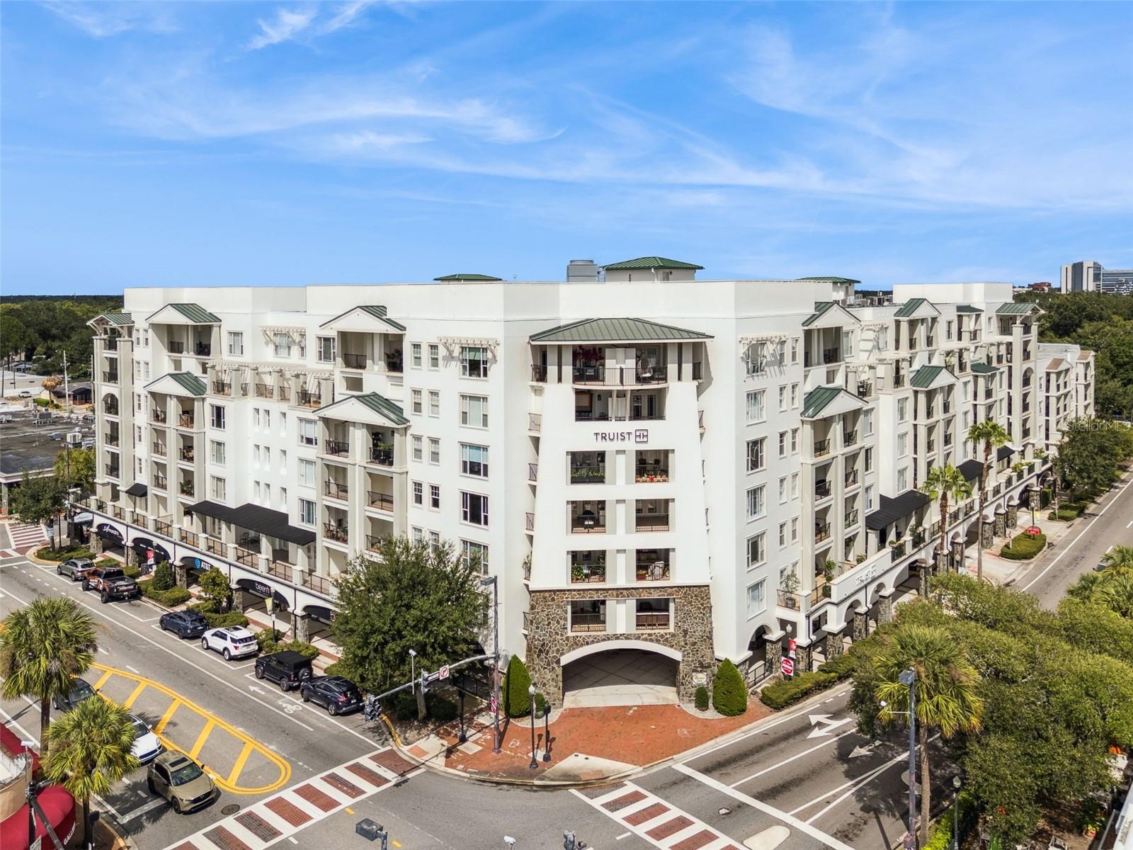 Rare opportunity to own a penthouse corner unit at The Wellesley! This stunning top-floor residence offers 2,399 sq. ft. of luxurious living space with windows and French doors on three sides and three private balconies showcasing sweeping views of College Park and Downtown Orlando. With no one above you, this home provides privacy, tranquility, and exclusivity rarely found in city living.
Beautifully designed and just freshly painted, the 3-bedroom, 2.5-bath layout is ideal for both everyday living and entertaining. A formal foyer entry opens to elegant living and dining rooms, while the gourmet kitchen features custom cabinetry, bar-top seating, stainless steel appliances, and double built-in ovens. The kitchen flows seamlessly into the family room, which offers French doors leading out to one of three lanais.
The spacious master suite is a private retreat with his and hers walk-in closets, a stand-alone soaking tub, handcrafted granite vanity with double sinks, and elegant finishes. Secondary bedrooms are well-sized, with ample light and balcony access. Throughout the home, you’ll find hardwood floors, high ceilings, crown molding, recessed lighting, and abundant natural light.
Located in College Park’s premier residence, The Wellesley offers unmatched amenities: a rooftop heated pool with surrounding gardens, club room, private suite for guests, fitness center, wine room, concierge service, and secure building access with reserved parking.
This is a rare chance to experience penthouse living in the heart of College Park!