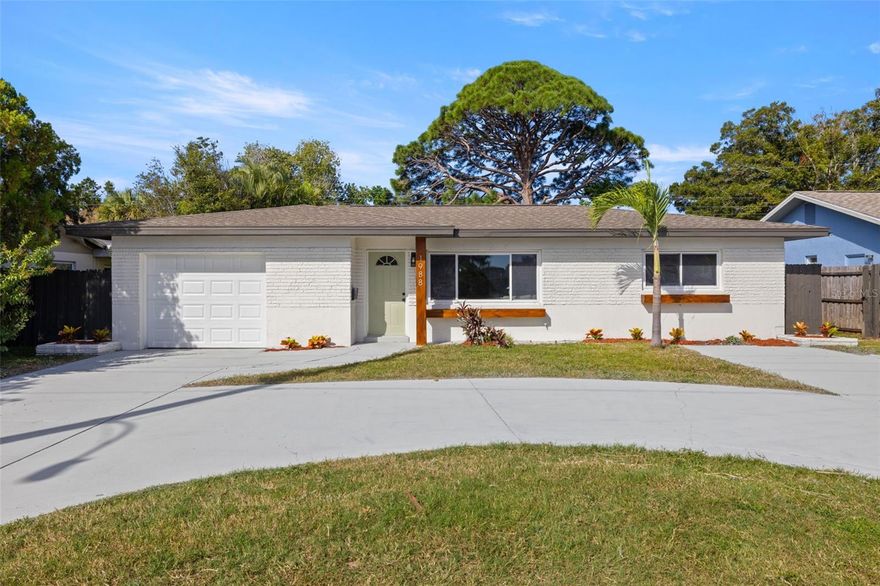 Welcome to this updated 3 bedroom, 3 bathroom home offering modern comfort, two living spaces, and a prime St. Pete location!
Step inside to discover a bright open living space perfect for entertaining or relaxing that seamlessly transitions to a tastefully styled kitchen along with a dry bar and featuring a new range, range hood, and dishwasher. The home offers multiple dining options, including a formal dining area for sit-down dinners or casual countertop seating in the kitchen—perfect for gatherings large or small. The massive primary ensuite is a true retreat, offering a dedicated seating area and two walk-in closets, providing the perfect blend of space, comfort, and functionality. The one-car garage comes equipped with a mini-split system that allows for the added convenience of a home gym, workshop space, or simply an air-conditioned storage area, giving you extra flexibility for your lifestyle needs. HVAC unit 2025 with 10 year transferrable warranty. A spacious circular driveway provides ample parking and enhances the home’s welcoming curb appeal. Located just 10 minutes from vibrant Downtown St. Petersburg, you’ll enjoy easy access to the St. Pete Pier, Tropicana Field, and Central Avenue’s dining and nightlife. You’re also 15 minutes from Treasure Island Beach and close to Tyrone Square Mall and the Grand Central District!