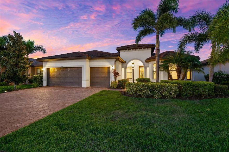 One or more photo(s) has been virtually staged. INTRODUCING THE PERFECT PINNACLE! Prepare to be captivated by this exceptional Estate Series PINNACLE MODEL, offering breathtaking water views and situated in the highly sought-after 55+ Del Webb community of Lakewood Ranch—the nation’s #1 multi-generational expert-planned development. This exquisite residence delivers the ultimate in luxurious Florida living, blending timeless elegance with modern upgrades and everyday functionality. With 3 bedrooms, a versatile den, and a spacious open layout, this home is ideal for both entertaining and daily comfort. Designer touches are found throughout, including crown molding, 5 ¼ baseboards, tray ceiling in the owner’s suite, gorgeous coffered ceiling in the den, designer fans, upgraded lighting fixtures, and hurricane impact glass for peace of mind. At the heart of the home, the gourmet kitchen inspires culinary creativity, featuring a massive island with seating for four, modern pendant lighting, 42” solid wood cabinetry, elegant quartz countertops, stylish backsplash, gas cooktop with upgraded hood, generous storage and prep space, and a custom pantry with built-ins. The home is finished with hard surface flooring throughout that includes a mix of light ceramic tile in the main living areas and rich wood plank flooring in the bedrooms and den, creating a yet warm ambiance. For seamless entertaining, open the zero- corner sliding doors to the extended, covered lanai where you will find ample space for dining, lounging, and tranquil water views—the perfect backdrop for Florida evenings. The expansive owner’s suite offers room for a cozy sitting area and a spa-inspired ensuite with dual vanities, large walk-in shower with a grab bar for safety, and an oversized custom walk-in closet with built-ins and abundant storage. Two additional guest bedrooms, including one with its own ensuite, custom closet, a versatile den with a coffered ceiling—ideal as a home office, gym, craft room, or library. Additional highlights include a 3-car garage built-in storage cabinets, upgraded laundry room with solid wood cabinetry, utility sink, extended screened lanai for ultimate outdoor living. Act quickly. Don’t miss the chance to call this Pinnacle Model showpiece your own and experience luxury living at its finest. Schedule your private tour today!