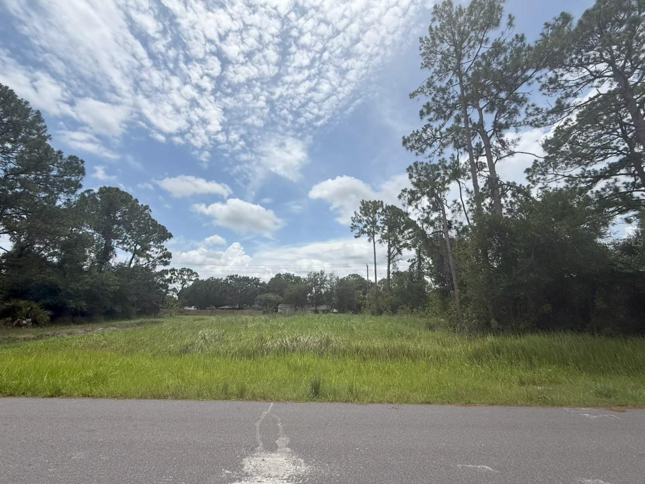 Vacant wooded residential lot in the desirable Port?Malabar community! This .24-acre parcel features an 83’ wide street frontage, ideal for your custom-built dream home with ample space for a private yard and outdoor amenities. Located on a paved street with nearby utilities. It offers a serene setting within close proximity to schools, parks, shopping, and dining. No HOA makes it easy to build on your schedule. Don’t miss this opportunity to create your perfect retreat in a well-established Palm Bay neighborhood!
