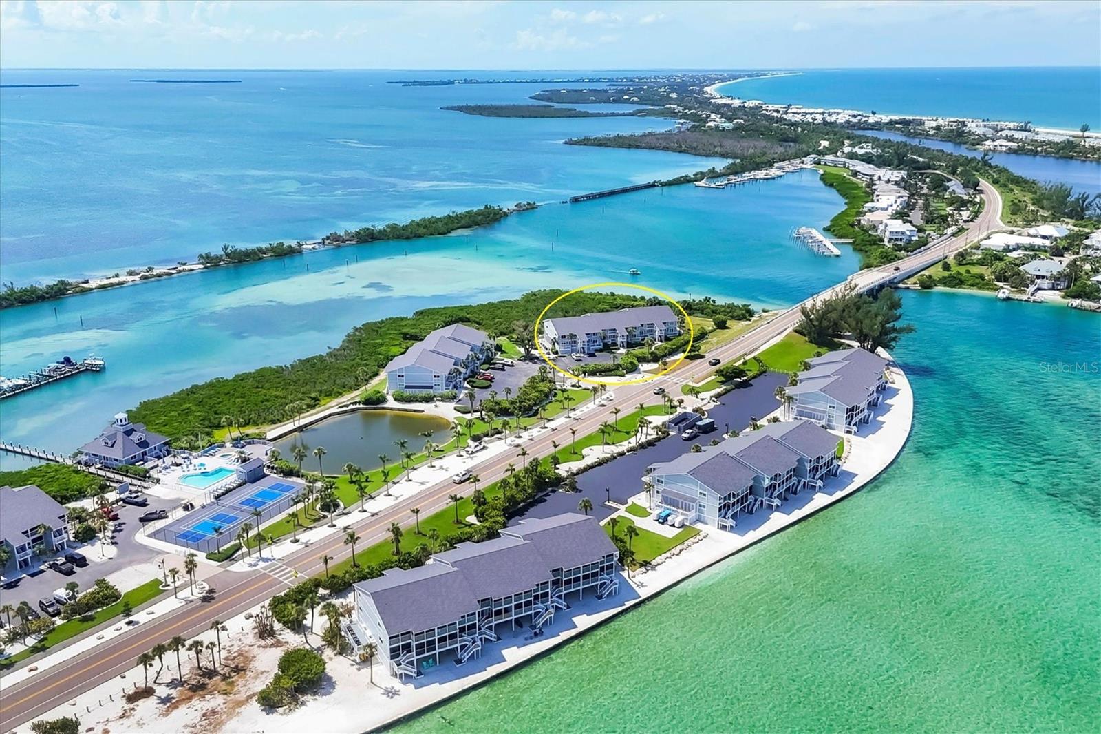 BOCA GRANDE NORTH 2 BED CONDO AND SLIP WITH 10,000LB LIFT!
Bayfront, first floor Boca Grande North condominium with Marina and Intracoastal water views! The boat slip is easily accessible and has water and electricity! This furnished 1,248 sq. ft. unit has amazing sunrise views from the master bedroom and living room screened porches and sunset views off the guest bedroom’s private balcony! The first-floor location offers easy walk up with groceries and direct walkout off the rear screened lanai. The kitchen was reconfigured with a large marble island and kitchen countertops plus all new stainless steel Samsung appliances! The new coastal furnishings create a comfortable space to call home! A new air conditioner and hot water heater have been installed, new washer and dryer are included, and new impact windows and doors! The property is practically brand new after being renovated from the studs! All electrical and plumbing was updated, spray foam insulation was added, and new drywall, LED lighting, and luxury vinyl flooring are installed throughout! Part of the rebuilding included additional strapping around all trusses and rods connected from roof to foundation and the pilings below. Boca Grande North offers you a secure gated community, heated swimming pool and spa, tennis / pickle ball court, outdoor BBQ grills and streetlights, and a private sea walled beach area on the gulf side. There is also a golf cart parking pad and charging area! Call for a showing today!