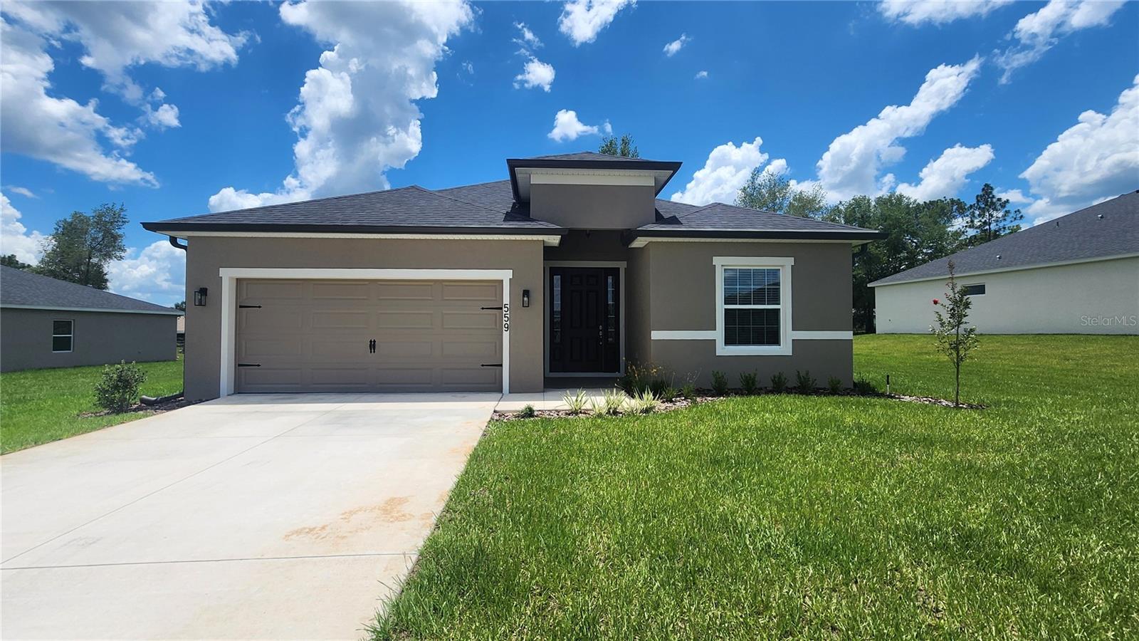 Be the very first to call this stunning brand new built home yours! This thoughtfully designed 4 bedroom, 3 bathroom home offers spacious living, modern finishes, and a move-in ready experience, all in a fantastic location near shopping, dining, and just minutes from town conveniences. Enjoy a light-filled open floorplan with soaring 9'4" ceilings, a beautifully appointed kitchen featuring a large counter-height island, walk-in pantry room, and adjacent dining café, perfect for special gatherings. The spacious owner’s suite boasts a grand double-door entry, tray ceiling, huge walk-in closet, and a luxurious en-suite bath with dual vanities and tiled shower. Additional highlights include a Jack-and-Jill bath with dual sinks for bedrooms 3 and 4, a convenient guest powder room, and an inside laundry room with folding table and laundry sink. Enjoy Florida living on the covered lanai, perfect for morning coffee or evening relaxation. All of this in a great location, close to grocery stores, retail, and all the amenities of town. Lawn maintenance is included at no additional charge! No pets allowed. First month’s rent, last month’s rent, and security deposit required. Full and complete background check required. This is your opportunity to live in a fresh, never-lived-in home with everything you need and more. More pictures coming very soon!