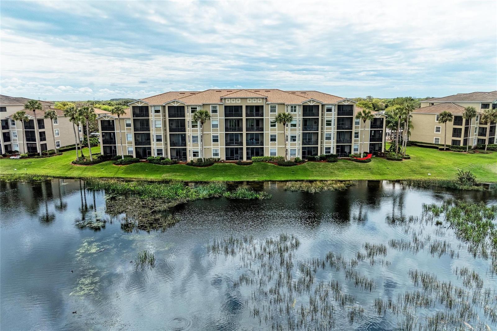 TRULY THE BEST OF THE BEST!!! A PREMIER RESIDENCE SHOWCASING REFINED LUXURY AND ELEGANCE WITH HIGH-QUALITY UPDATES AT EVERY TURN…. FORMER BUILDER’S MODEL —
This highly sought-after Colonade Model was the builder’s #1 choice for its premium location and exceptional design. Your wait is over—bring your offer today—this one won’t last!
First-Floor End Unit with Unforgettable Golf & Lake Views. Welcome to the Florida lifestyle you’ve been dreaming of! Nestled in the heart of River Strand Golf & Country Club, this exceptional Colonade Model—the largest condo floor plan available—offers a rare blend of elegance, comfort, and panoramic beauty. TURNKEY, FULLY FURNISHED, and GOLF-DEEDED, this first-floor end unit delivers privacy, convenience, and jaw-dropping views of the serene lake and the 7th hole of the Estuary Course. Step inside and be instantly swept away by the natural light pouring into this bright, open layout. With 2 bedrooms, 2 full baths, and a spacious den that easily transforms into a third bedroom, office, or peaceful retreat, this home adapts to your every need. The main living space is filled with refined touches—crown molding, a custom wood-paneled entertainment wall, designer fans and lighting, fresh neutral paint, and modern, easy-care flooring throughout (absolutely no carpet!). The kitchen is a showstopper: updated quartz countertops, stainless steel appliances, a charming shiplap breakfast nook, pantry, and an inviting dining space that’s perfect for gathering with friends or enjoying quiet mornings with a cup of coffee. Step out to your screened-in lanai, and take in the peaceful sights of the lake and lush fairways—your own private oasis for sunrises, sunsets, and everything in between. A newer HVAC system (2019), newer water heater (2024), newer microwave (2024), newer refrigerator (2020), and private storage unit add the finishing touches to this move-in-ready gem. Resort-Style Living Includes: *27 holes of championship golf designed by Andrew Green *2 resort-style pools + 6 satellite pools *Coming Soon renovated clubhouse with full-service restaurant, grill room & tiki bar * 2 state-of-the-art fitness centers *9 Har-Tru tennis courts & 8 pickleball courts *A vibrant calendar of events, fitness classes, and community activities year-round. All this, just minutes from I-75, the new Costco, top-tier dining, shopping, and Florida’s world-famous Gulf Coast beaches. This is more than a home—it’s a lifestyle. Don’t let this one-of-a-kind opportunity slip away. Schedule your private showing today and experience why so many fall in love with River Strand.