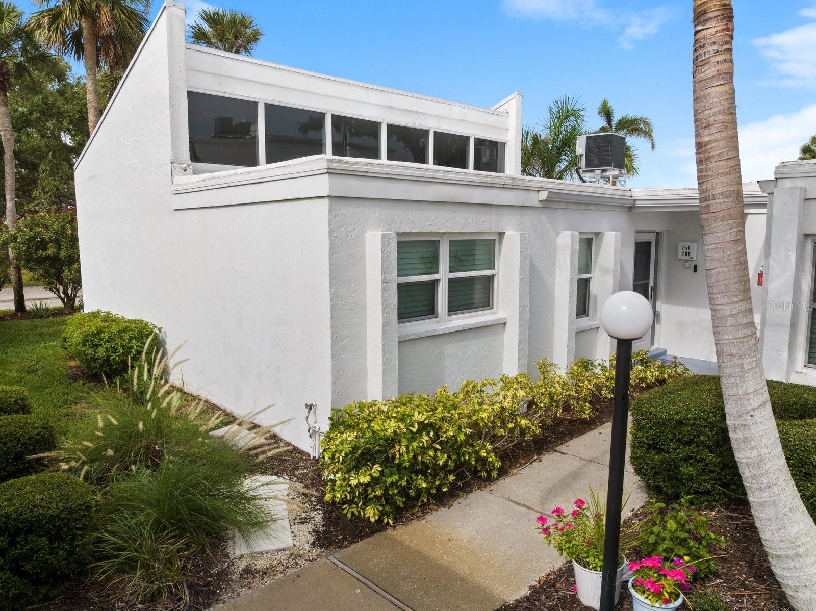 Featuring a beautiful bright 2-bedroom, 2-bath TURN-KEY FURNISHED rarely available CORNER END UNIT and the best is there is NO ONE ABOVE YOU and NO FLOOD ZONE! Upon entering this lovely Capri Isles condo, you’ll be wowed by the professionally decorated decor with a fabulous floor plan! The relaxing inspired beachy theme is found throughout as VENICE BEACH is ONLY 3.5 MILES AWAY! The impressive tile floors flow throughout every room, absolutely NO CARPETING in this spacious 1183 sqft home! You’ll immediately feel a sense of owner’s pride and attention to detail. The living room features CATHEDRAL CEILINGS BEAMING with NATURAL LIGHT from 6 UPPER CLERESTORY WINDOWS. This feels more like a PRIVATE HOME than a condo. A peaceful airy lanai is just off the living room with screened vinyl windows. A bonus side grassy yard for your furry pet and a PATIO for GRILLING or GARDENING! The updated bathrooms feature a relaxing tub for a quiet peaceful end of the day, and a tiled walk-in shower are tastefully updated! The kitchen has been renovated with solid wood cabinets and granite counter tops. There’s also a cherished walk-in pantry/storage room, with cabinetry and shelves, plus a hallway closet washer and dryer. The spacious master bedroom showcases a lovely bedroom ensemble, a deluxe adjustable Sleep number bed, a deep walk-in closet, and a gorgeous updated en suite bathroom. The guest bedroom provides a luxury king bed with a surrounding built-in wall unit with shelves for you personals or clothing used as a dresser. You’ll have peace of mind with a NEWER A/C (2020), NEW Electrical Panel (2023) NEW Roof (2022), Repiped waterlines (2018), BLINK security doorbell, plus a Wi-Fi SMART THERMOSTAT (allowing temp control from anywhere!). HOA INCLUDES: WATER/SEWER/TRASH, heated salt-water community pool, escrow reserve funds, insurance, exterior maintenance, maintenance grounds, and pest control. CAPRI VILLAGE EAST is PET FRIENDLY and a quiet 55+ Maintenance-free community. Your condo may also be RENTED MONTHLY OR ANNUALLY, making it a great investment opportunity! The clubhouse offers a HEATED SALT WATER POOL, kitchen for parties, restrooms, lounging chairs, and best of all, walking distance from your door. For golfers, Capri Isles Golf Course is just minutes away. Capri Isles is an ideal Venice neighborhood with sidewalks and street lamps for taking evening strolls or walking your dog. Our quaint historic downtown Venice is just over the bridge 3 miles away, offering a pavilion that host bands, a plethora of restaurants, boutique shops, and local theatre. Our famous Sharkey's on the Pier, along with several beaches are just 5 miles away to have your toes in the sand. Venice also offers the ONLY dog friendly beach in the area at The Brohard Beach and Paw Park, a quick 5 miles and your furry friend can join you on the beach! Other area benefits include the new-state-of-the-art Sarasota Memorial Hospital 2.5 miles away, quick access to Hwy 75, the Legacy Bike Trail, and the newly developed Wellen Park with unique restaurants & shops and offering FREE Friday night concerts in the park! Cool Day Stadium, the home of the Atlantic Braves, is also a huge attraction! Just a quick drive north, you’ll find the famous quartz sandy beach at Siesta, Key Beach, UTC MALL, and St. Armand’s Circle, and Anna Maria Island! Don’t hesitate to tour this unique move-in ready TURN-KEY FURNISHED home in Paradise!