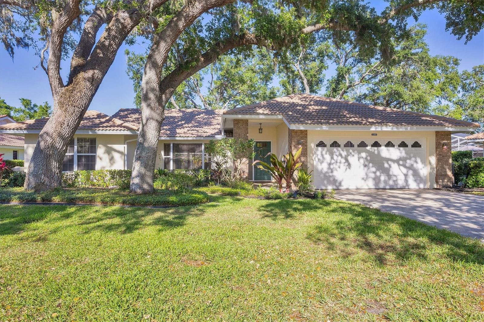 Welcome Home to your lakeside oasis with sparkling heated pool and amazing views throughout. Perfectly placed at the back of the neighborhood on a quiet cul-de-sac. So close to everything but you'll feel miles away in what can only be described as a nature lovers paradise. The home has been beautifully updated and well maintained. The interior was just painted along with the garage and pool deck. The Kitchen features a new Whirlpool refrigerator and convection oven w/ air fryer option along with a dishwasher, farm sink, breakfast bar, granite counters & stunning high-end soft close solid wood cabinetry. Wake up to beautiful lake views from your large owner’s suite & enjoy direct access to the Florida room via sliding glass doors. The large walk-in closet and secondary closet provide ample space for all your needs and the ensuite bathroom features an oversized granite top vanity with the same granite & high-end cabinetry you’ll see in the kitchen, second bathroom and dry bar. The shower features sliding glass doors and a built-in bench. A new HVAC was installed in 2020 & the pool heater received a new compressor in November of 2024. Across the home from the owner’s suite, tucked behind a door you’ll find a nicely sized secondary bedroom and bathroom that provides in-law suite privacy for your guests. A beautiful paver driveway and front entry will greet you as you enter this tranquil retreat. The 2-car garage features an insulated garage door, epoxy flooring, a secondary fridge, and a new opener that was updated in 2022. Home has updated lights, fans and fixtures throughout and has beautiful luxury vinyl flooring and ceramic tile providing easy upkeep. The 3rd bedroom makes a great flex space, home office, or anything else you can dream up. One of the best features of the home is the large sliders that run across the back of the home and Florida room & wrap around to the kitchen and breakfast nook. Stunning lake views can be enjoyed from almost anywhere in the home. The Florida room is also a great place to relax and enjoy year-round whether you want to curl up with a great book or enjoy a great sunrise with your favorite beverage. The large pool deck was just painted and features flower beds with easy irrigation. This high ceiling, open concept home is perfect for entertaining, and the living room features a dry bar. Garden lakes is a maintenance free 55+ community that takes care of your yard and all of the trees and landscaping. Your cable, internet and trash are also covered by the association. It’s conveniently close to shopping, dining, entertainment, golf and only 30 minutes to the beach but the beautiful, wooded landscape will make you feel like you are miles away from the hustle and bustle! The sounds of nature can be enjoyed throughout this friendly neighborhood, rich in amenities such as a heated community pool, shuffleboard, tennis, fitness room, pickle ball and has a great social calendar full of clubs and activities. The true definition of a friendly neighborhood where neighbors gather and help one another. Take and tour and fall in love with this lakeview home today!