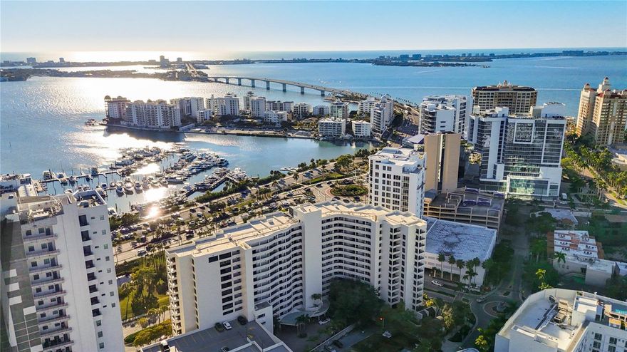 IF YOU WANT FULLY UNOBSTRUCTED Sarasota Bay views welcome to Unit #1407 at Bay Plaza!  An exceptionally rare opportunity to own in the iconic Tim Siebert designed, (Sarasota School of Architecture), coveted Bay Plaza on the rarely available 14th floor.  This residence is a 2 bedroom/2 bathroom Bay front home offering spectacular fully unobstructed panoramic views of Sarasota Bay, Marina Jack, the city skyline and our breathtakingly beautiful Sarasota sunsets, from every room.  Enjoy views for DAYS that are so breathtaking that you will understand why this location is the heartbeat of Sarasota and so sought after.  Designed with a desirable split floor plan, this residence balances privacy and flow, complemented by two private Bayfront balconies ideal for morning light and evening gatherings.  Floor to ceiling windows fill this home with natural light, creating an atmosphere that is both refined and enduring, where the Sarasota Bay becomes a timeless backdrop to everyday living.  The primary suite serves as a peaceful retreat with direct unobstructed Bayfront balcony access and sweeping water views, while the guest suite offers comfort and privacy - perfect for extended stays and visiting family or friends, with dazzling unobstructed views.   Bay Plaza is a full-service waterfront condominium offering 24-hour concierge and security, onsite management, heated pool and spa, fitness center, sauna, social room, valet guest parking and secure building access.  Step outside your front door and enjoy immediate walkability to Sarasota's vibrant downtown lifestyle, including fine dining, cafés, art galleries, theatres, marina walks and year round cultural events.  A legacy caliber residence equally suited as a refined primary home or an exceptional second home retreat.  A wonderful opportunity awaits you to live in one the most elegant addresses in the heart of downtown Sarasota.