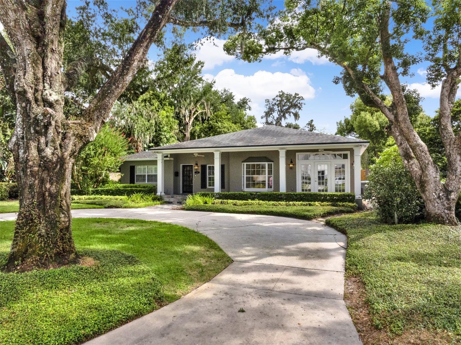 Amazing opportunity in the Forest Hills subdivision in the heart of Historic Winter Park! As you enter this charming 4 bedroom home you’re welcomed by a spacious dining room that flows seamlessly into the large family room with fireplace, custom built-in shelving and storage cupboards, crown moulding and views over the rear yard and patio, perfect for relaxing or entertaining. To the front of the home, enjoy a bright and expansive kitchen/family space featuring upgraded appliances including a Sub-Zero refrigerator and built-in coffee maker, stone countertops, and ample room for casual dining and lounging. The private primary suite includes its own bathroom, while three additional generously sized bedrooms share well-appointed bathrooms. Hardwood floors, charming details, and mature landscaping add timeless appeal. Set on a tree-lined street with a circular driveway, just minutes from Park Avenue, Rollins College, and top-rated schools, this is your chance to create your dream home in one of Winter Park’s most coveted neighborhoods!