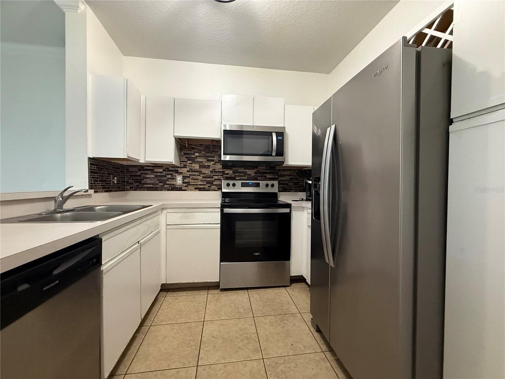 Photo of 2674 Robert Trent Jones Drive #337, Orlando, FL 32835 (MLS # O6433551)