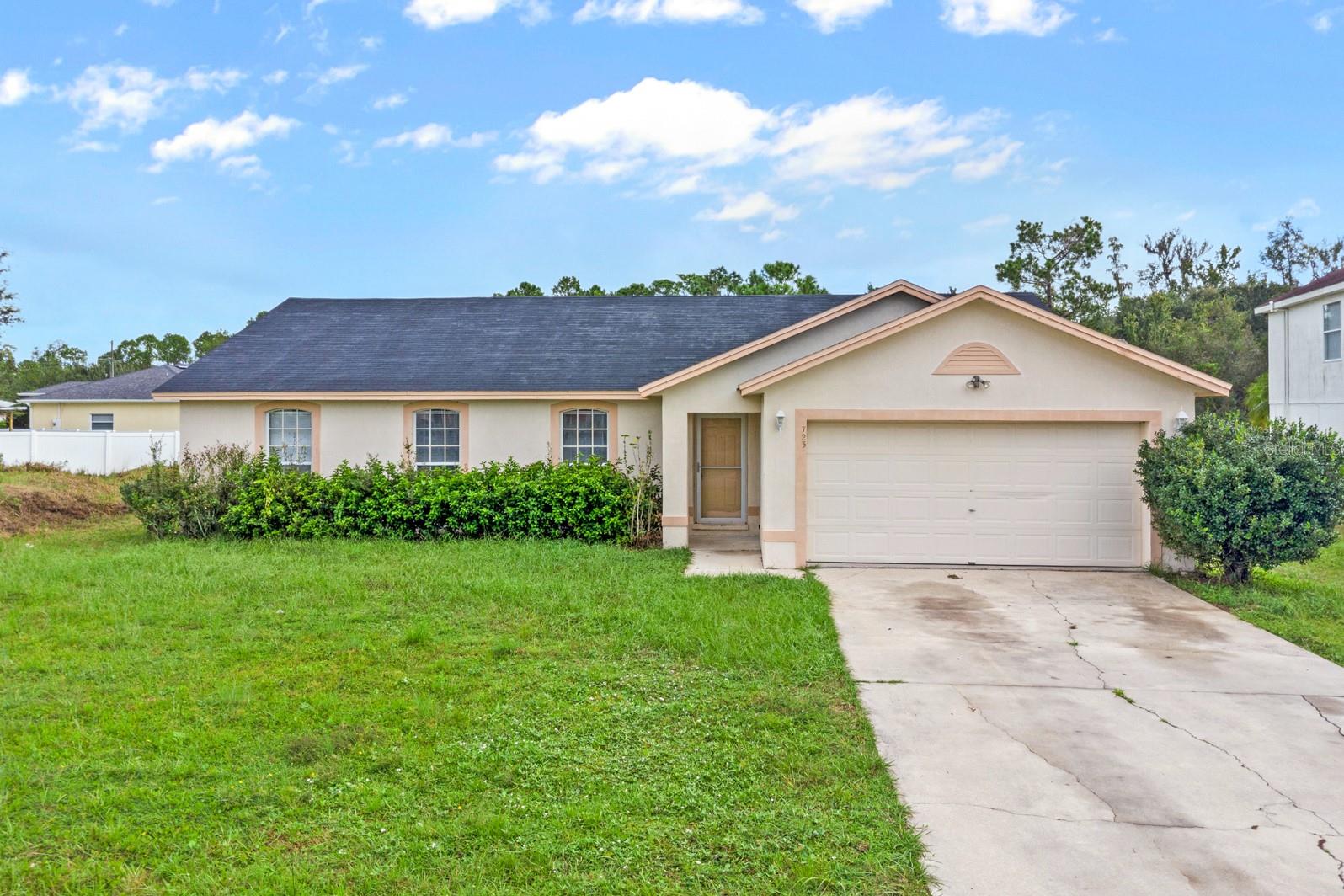 Great first time buyer opportunity in South Kissimmee! This spacious 4 bedroom 2 bath home features a popular floor plan with vaulted ceilings and neutral colors throughout, new Flooring in all the house, new inside painting, with new stove and dishwasher too. The master retreat with ensuite offers an oversized garden tub and separate stand up shower. This rare oversized lot backs up to peaceful conservation which can be enjoyed from your private covered/screened patio. This home will not last! Call us today and schedule a showing! Financing offers are required to be pre qualified with Loan Leaders. Selling As-Is with right to inspect. If exact square footage/measurements or HOA data are a concern, home should be independently measured or verified.