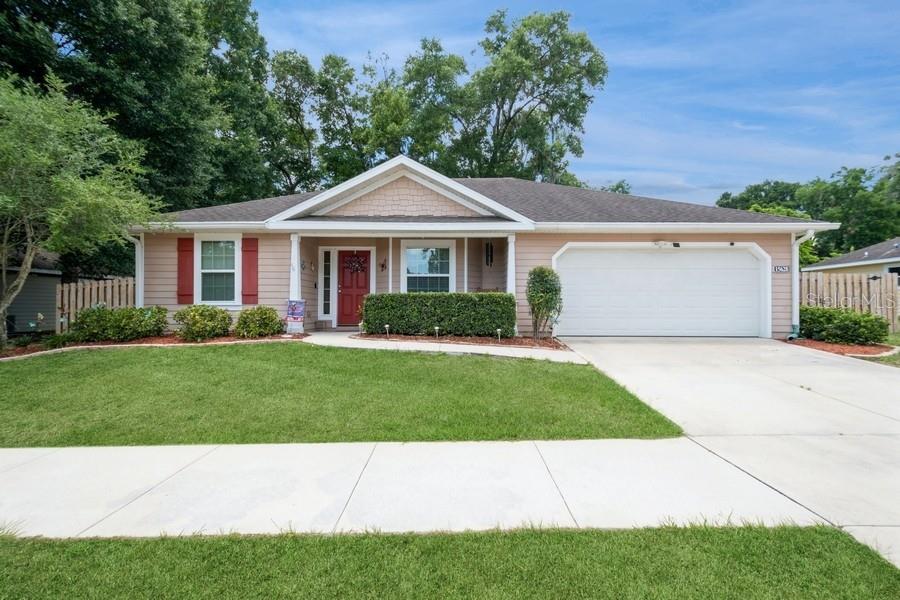 Great location near downtown Alachua and priced to sell. Lovely well maintained 4BR/2Ba in quiet neighborhood. One Owner. Hartley Brothers home. Home includes gutters, full-house water treatment system, ceiling fans, nickel finishes, breakfast bar, large fenced yard. Water Heater 2023. Tray ceilings in master bedroom. Outdoors area has a 10X12 screened patio as well as a concrete slab on side of home for grilling or container garden. Laminate flooring throughout. High definition laminate counter tops and Oak Cabinets. Fridge and Washer and dryer do not convey.