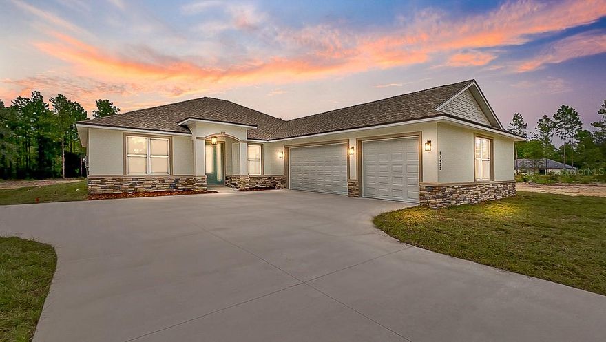 Pre-Construction. To be built. Welcome to THE HAVEN — where thoughtful design meets timeless style. This PRE-CONSTRUCTION 4-bedroom, 3-bath home spans over 2,600 square feet and includes an OFFICE/FLEX SPACE plus a 3-CAR GARAGE. Located on 1.33 ACRE LOT. Every inch has been crafted with quality, comfort, and attention to detail in mind. The 3-way split floor plan ensures privacy for every member of the household, while open, light-filled living spaces invite effortless everyday living and entertaining. The primary suite is a peaceful retreat featuring tray ceilings, two closets, and spectacular backyard views. Step into the SPA-INSPIRED BATHROOM with dual granite vanities, a SOAKING TUB and an elegant tiled walk-in shower—your personal sanctuary. Guests or extended family will love the PRIVATE ENSUITE with its own full bath and direct lanai access—ideal as an in-law suite. A stylish barn door separates the third and fourth bedrooms with a shared bath and linen closet. The kitchen shines with granite countertops, stainless steel appliances, 42” soft-close cabinetry, a spacious center island, and luxury touches like a pot filler, range hood, and custom backsplash. Just off the kitchen, a MUDROOM with a built-in coffee/wine bar, L-shaped walk-in pantry, and convenient bench seating makes daily life easier and more enjoyable. The open-concept living area impresses with VAULTED CEILINGS and 9’4” walls, flowing seamlessly to the covered lanai and large private backyard—perfect for hosting gatherings or relaxing under the stars. Additional highlights include a flexible OFFICE with French doors, a WELL WATER FILTRATION SYSTEM, a thoughtfully designed laundry room with granite folding station, and a 3-GARAGE with side service door and windows. A beautiful partial glass front door enhances the homes curb appeal. Photos and video are from a previous model and may include buyer-selected paid upgrades (stone veneer accents on the front elevation and luxury vinyl plank flooring in the bedrooms). (Barn door not featured in video/pictures) This is a pre-construction opportunity, allowing you to be part of the building process from the start. This home is available for pre-construction, giving you the opportunity to choose your preferred finishes and details from the builder's selections. The builder works with cash held in escrow (paid in construction draws) or construction-to-perm loan (VA or conventional) financing with incentives through the builders preferred lender.