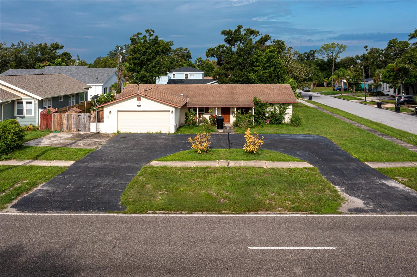 Unveil the possibilities at 1530 49th Street North in St. Petersburg, FL, a prime double lot positioned in a central locale between the city’s stunning beaches and dynamic downtown. Boasting over 50 feet above sea level, this property is not in a flood zone and is in a Non-Evacuation Zone, offering security and peace of mind. The expansive 10,000-square-foot lot, split into two 50ft x 100ft parcels, invites creative development. Imagine crafting two new homes, each potentially ranging from 1,700 to 2,500 square feet, amidst a neighborhood of inspiring new builds.?Currently, the lot houses a charming 1,413 square foot home featuring 2 bedrooms and 2 bathrooms. Additionally the house has an enclosed porch which could add 288sq ft to the home. The attached garage, circle drive, and guest parking provide ample space for vehicles, while the private deck offers a perfect outdoor escape. This is an Investors Dream!! Located just minutes from the Tyrone Mall area, the serene beaches, and approximately 30 minutes from Tampa International Airport, this property delivers convenience and opportunity. Whether maintaining the current home or embarking on a new building adventure, 1530 49th Street North offers a harmonious blend of location, lifestyle, and limitless potential.