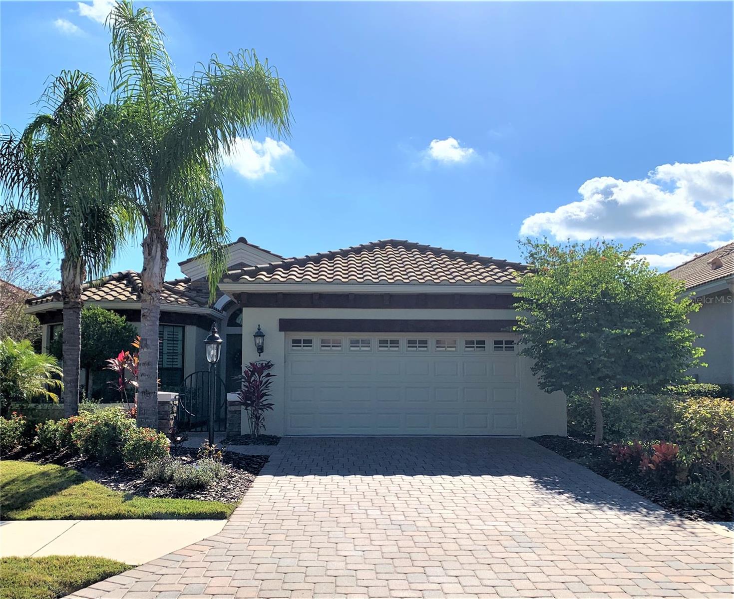 This stunning single family house in the gated Country Club East Community of Lakewood Ranch boasts breathtaking views of the lake and golf course. Fully furnished and move-in ready, this home offers three bedrooms plus a den/office, 2.5 full baths, and an expansive pool area. The bright and cheerful interior is accentuated by large windows and high ceilings, providing natural light throughout. The open layout and separate dining area make this home perfect for entertaining, while the work-island, gourmet kitchen, granite countertops, wood cabinets, breakfast bar, and pantry make cooking a breeze. The master bath features dual sinks, a large walk-in shower, and spacious double walk-in closets. Sliders lead to the expansive pool, spa, and outdoor kitchen, creating a great room for gathering with family and friends. Renters will appreciate that pool and lawn care are included in the rental. In addition, Country Club East amenities include two community pools, a sand volleyball court, playground, A-rated schools, and a newly built third community pool with a clubhouse and fitness center. The home's convenient location provides easy access to hospitals, doctor's offices, shopping centers, restaurants, cinemas, recreation areas, the I-75 highway, and the famous UTC mall. Don't miss out on this opportunity to live in luxury and style in one of Florida's most sought-after communities.