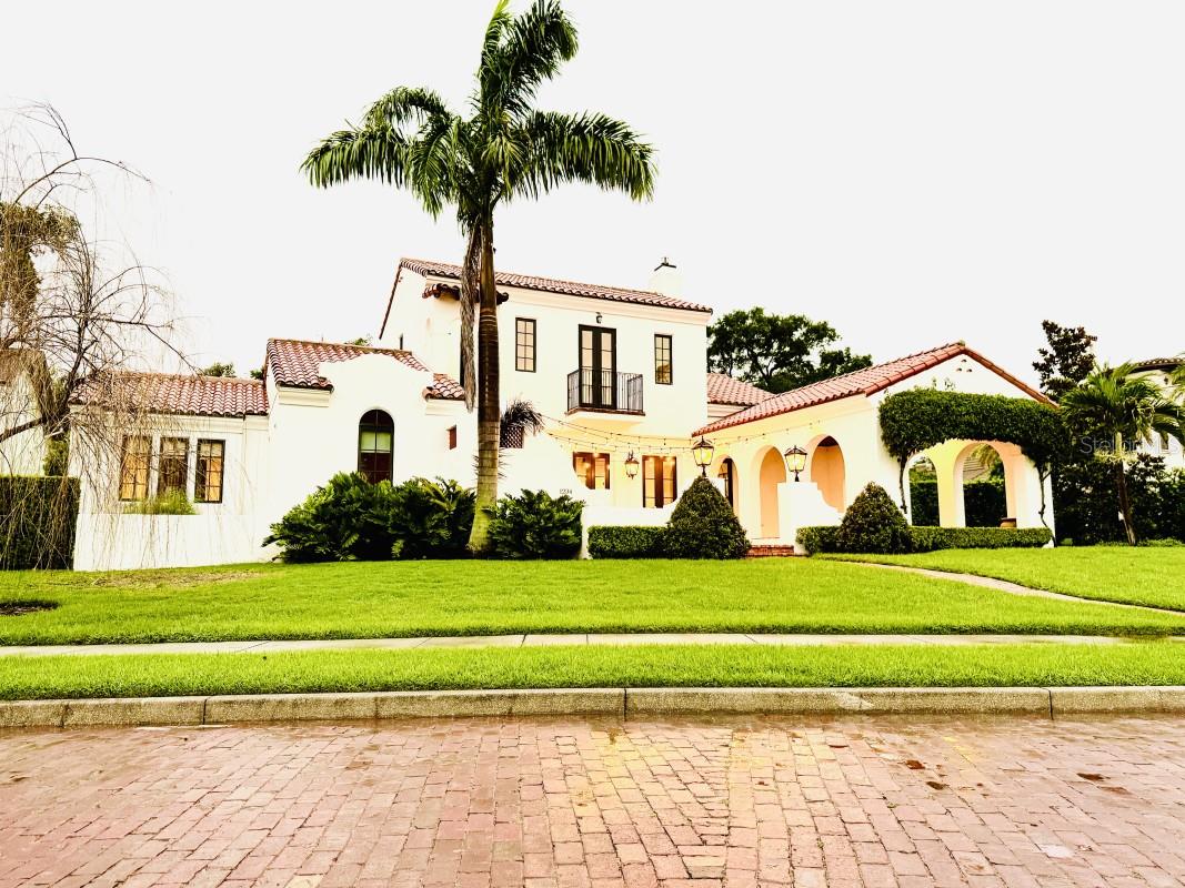 Luxury custom pool residence in College Park on Lake Ivanhoe.
Truly one of a kind offering, a Ron Manzo custom designed mediterranean pool home, completed in 2019, in the heart of College Park with an unobstructed view of Lake Ivanhoe.
This unbeatable College Park location is walking distance to Edgewater Drive shops, Ivanhoe Village & Princeton Elementary School. Easy access to I-4 ramps.
One of the most authentically designed mediterranean homes in College Park with clay barrel tile roof, traditional oak flooring, wood beams, 4 bedrooms and 3 ½ baths 3000 sq ft.
The family room with a beautifully designed gas fireplace is the heart of the home and the open floor plan flows effortlessly into the chef's kitchen & adjacent dining area.
The kitchen features Thermador appliances, including column refrigerator, freezer, 48” gas range with double oven and griddle, dishwasher, and high volume insert hood as well as custom floor to ceiling cabinetry and crown moulding.
The downstairs Master suite features walk-in his & hers closets and the ensuite bath offers a freestanding tub, oversized walk-in shower and a double vanity.
Maybe the most alluring part of this home is the outdoor living area. The massive covered front porch with trellising bougainvillea frames the arched opening, stained ceilings with a view of the lake and park. A bricked courtyard with a fountain & exquisite stairway to the second floor.