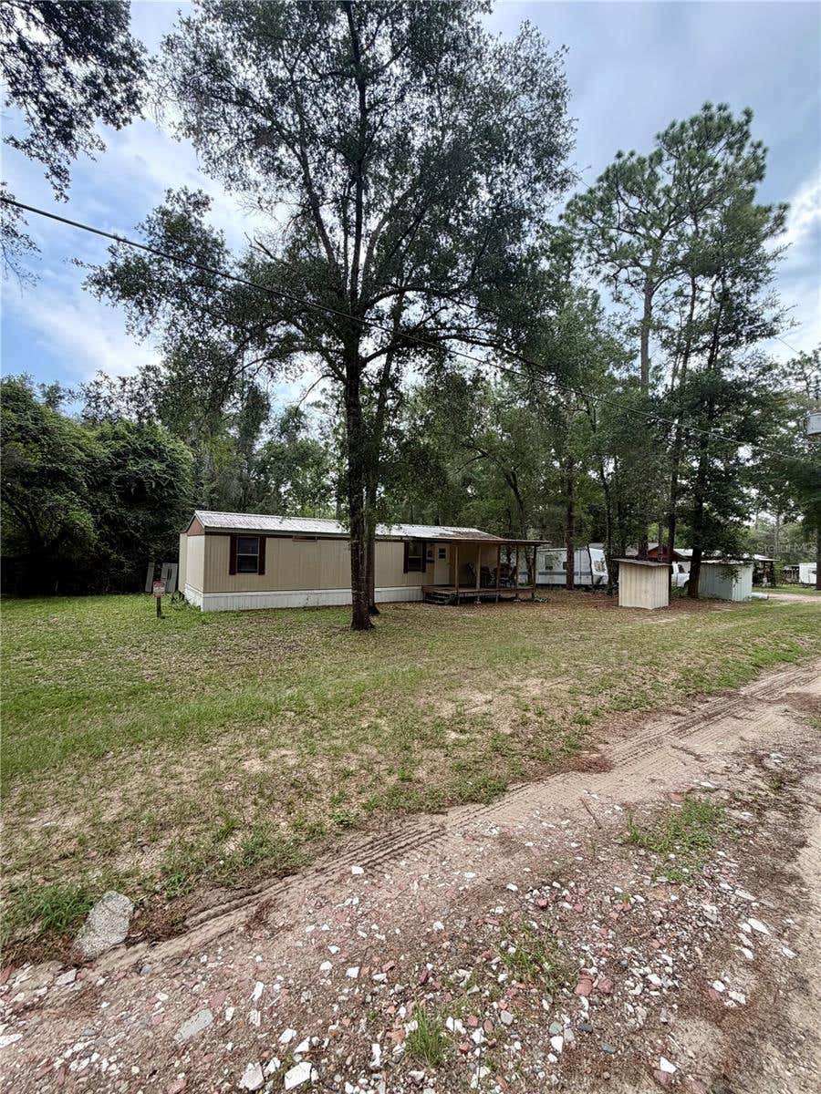 Photo of 20445 NE 144th Lane, Fort Mccoy, FL 32134 (MLS # OM730158)