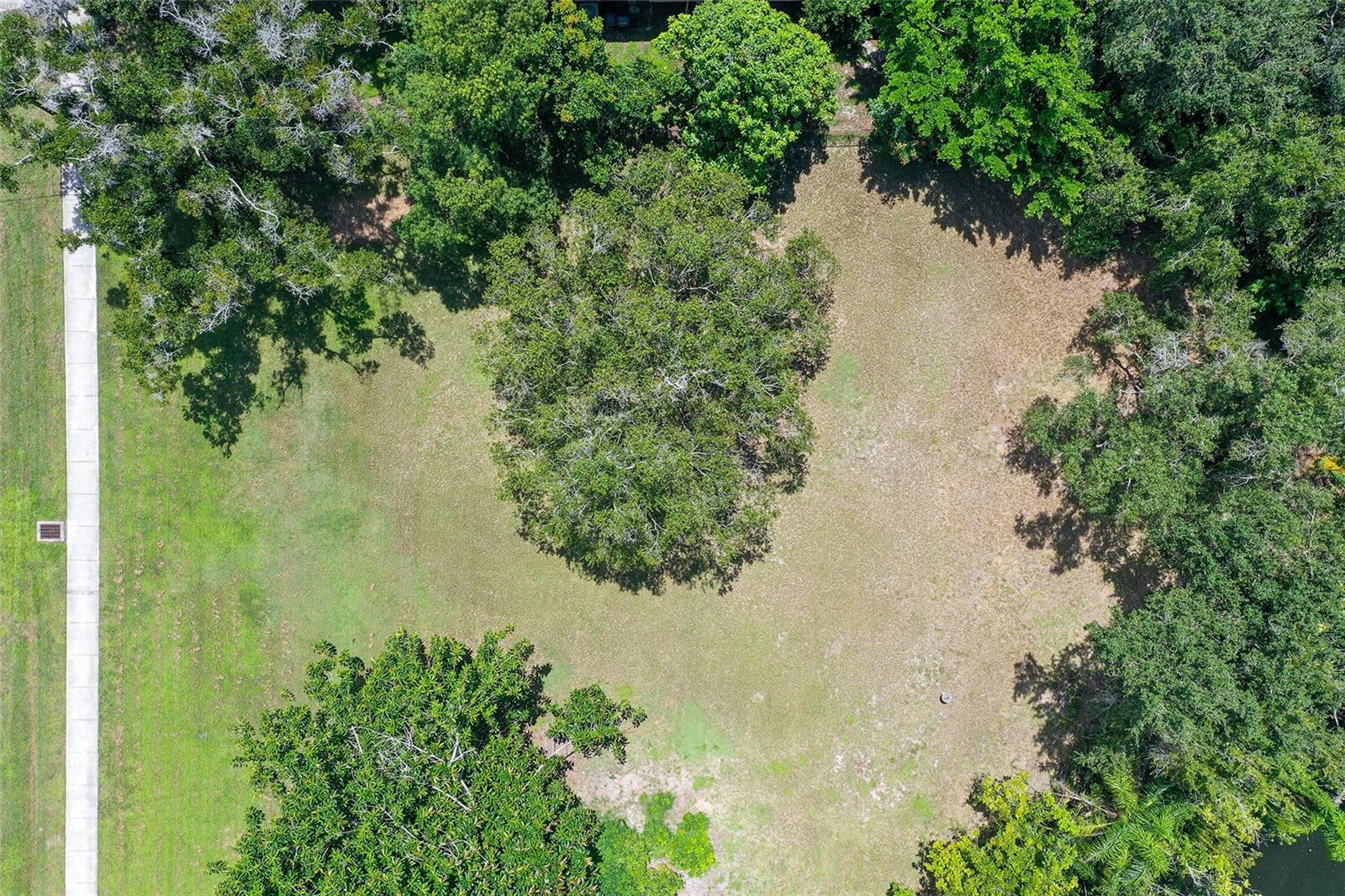 Prime Vacant Lot! Rare Opportunity to Build Your Dream Home in this desired Sarasota Location! This vacant lot is your chance to create the perfect home in an established, sought-after neighborhood. Discover one of the most coveted pieces of real estate in Sarasota. This exceptional property offers unmatched versatility. The front of the property is mowed, and the back is wooded, left in its natural state, with a lake at the back. Ideally located just minutes from I-75, top-rated schools, Sarasota’s best restaurants, and major shopping centers. convenience meets lifestyle here. Don't miss your opportunity to bring your vision to life in one of Sarasota's most desirable areas.
