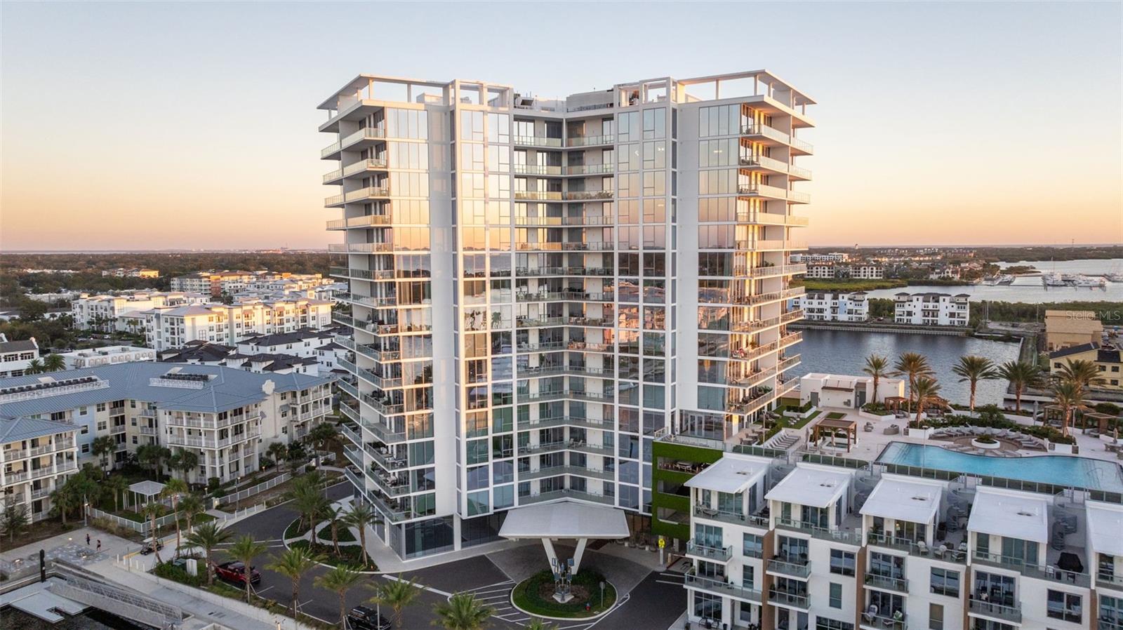 PRICED TO SELL! At $93 less than the average price per square foot for the larger units available, this one of kind unit is a steal! This 3,036 sq ft luxury condo—the LARGEST unit currently available—offers not one, but TWO spacious primary suites, each a private retreat with spa-inspired baths and generous closets, including one bathroom that overlooks the bay for a truly serene escape. Rising above the exclusive Westshore Marina District, this 12th-floor residence at Marina Pointe Tower 1 offers refined living with commanding, unobstructed views of every bit of water the Marina District has to offer. Floor-to-ceiling windows frame waterfront views from every room, while two expansive balconies provide a combined 520 sq ft of outdoor living space: one west-facing 8'x40' balcony ideal for spectacular sunsets and pool views, and one 8'x25' balcony offering additional serene bayfront vistas. The open layout blends elegance with functionality, featuring a chef’s kitchen with Wolf and Sub-Zero appliances, quartz countertops, and a dramatic waterfall island flowing seamlessly into expansive living and dining areas. Two additional bedrooms provide versatile space for family, guests, or a private office. With ample storage and access to resort-style amenities—including a rooftop pool, fitness center, and private marina—this residence embodies luxury waterfront living just minutes from downtown Tampa and St. Petersburg. ** Option to purchase a boat slip available.