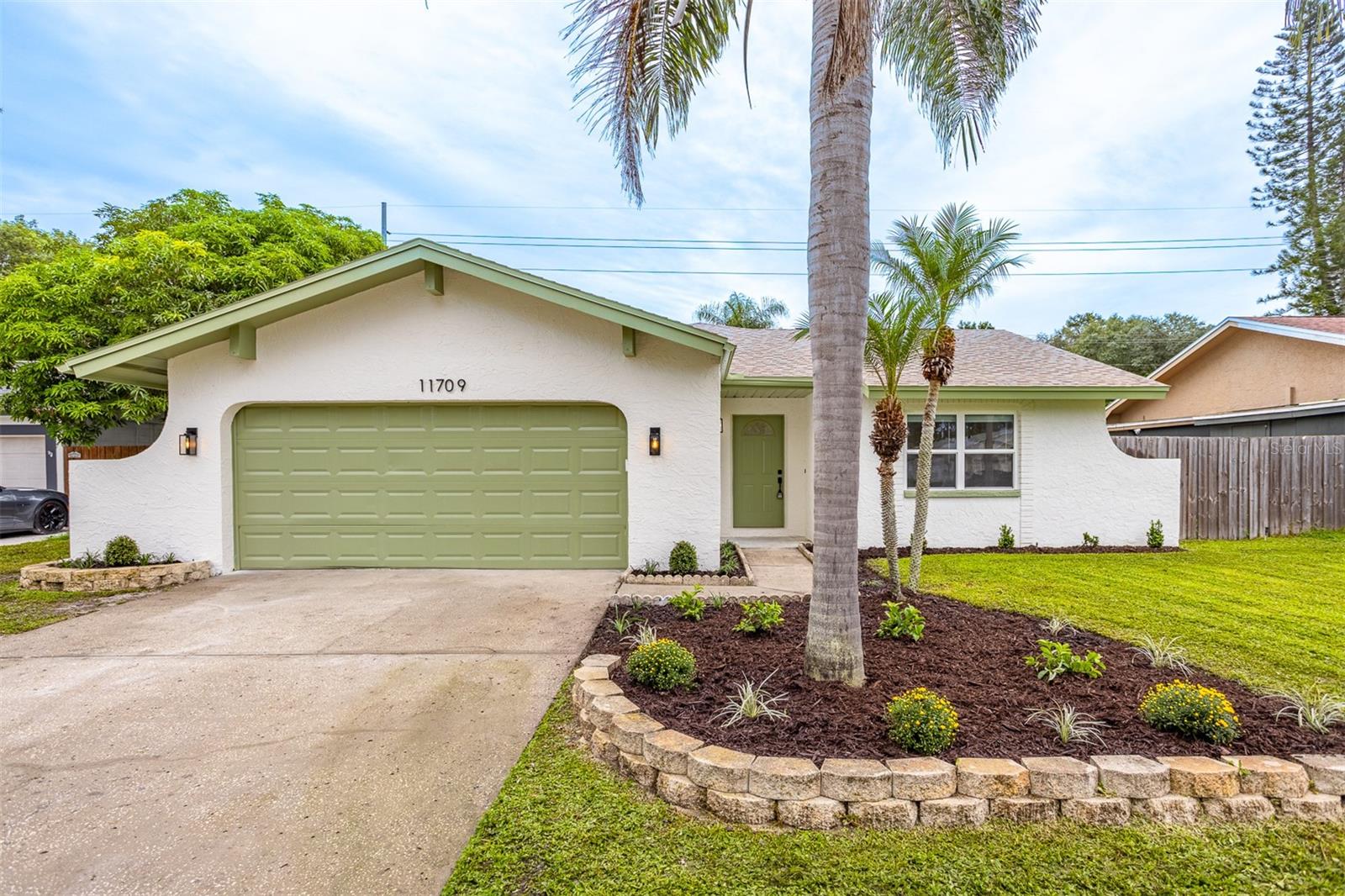 Welcome to Beacons Meadows in Carrollwood! Step into this beautifully updated 2-bedroom, 2-bath, 2-car garage pool home featuring a smart and stylish layout designed for everyday living. Situated on a quiet street near the cul-de-sac, this property is truly turn-key with a long list of modern upgrades.
The home greets you with fresh landscaping, new exterior paint, and palm trees in the front yard, setting a warm and inviting curb appeal. Inside, enjoy fresh interior paint, new light fixtures, ceiling fans, and durable vinyl flooring throughout. The kitchen showcases white shaker cabinets, Cappuccino quartz countertops, stainless steel appliances, a custom island with range hood, and a cozy nook off the living room perfect for a home workspace or desk. There is also room for dining within the living area, offering flexibility for gatherings and everyday meals.
The primary suite offers a walk-in closet, new vanity, and a fully updated bathroom with shower glass enclosure. Both bathrooms feature champagne bronze Delta plumbing fixtures and contemporary finishes. Throughout the home, double-pane windows flood the rooms with natural light, enhancing the open and inviting feel.
Unwind in the spacious living room with a wood-burning fireplace, or head outdoors to the covered back patio overlooking the sparkling pool and newly landscaped yard ideal for entertaining or relaxing evenings at home. Located in the heart of Carrollwood, this home combines comfort, convenience, and style!
Roof (2020), HVAC (2022), Water Heater (2025).