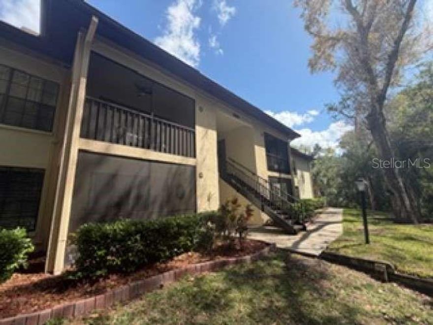 Welcome to this beautifully maintained condo nestled in a peaceful, park-like setting in Palm Harbor. This inviting home features a bright, open layout with updated flooring throughout and an abundance of natural light. The spacious living area flows seamlessly to a screened-in balcony overlooking a private, wooded backdrop, perfect for relaxing and unwinding in a quiet setting.
The kitchen is clean and functional, offering ample cabinet storage and a convenient breakfast bar for everyday living. The generously sized bedroom features a large window with serene views of the surrounding greenery, creating a calm and comfortable retreat. The bathroom has been tastefully updated with modern finishes, adding a fresh, move-in-ready feel.

Additional highlights include in-unit laundry, ample storage space, and a well-maintained interior. Located in a beautifully landscaped community, this condo offers low-maintenance living just minutes from shopping, dining, and the Gulf beaches. Perfect as a primary residence, seasonal getaway, or investment opportunity.