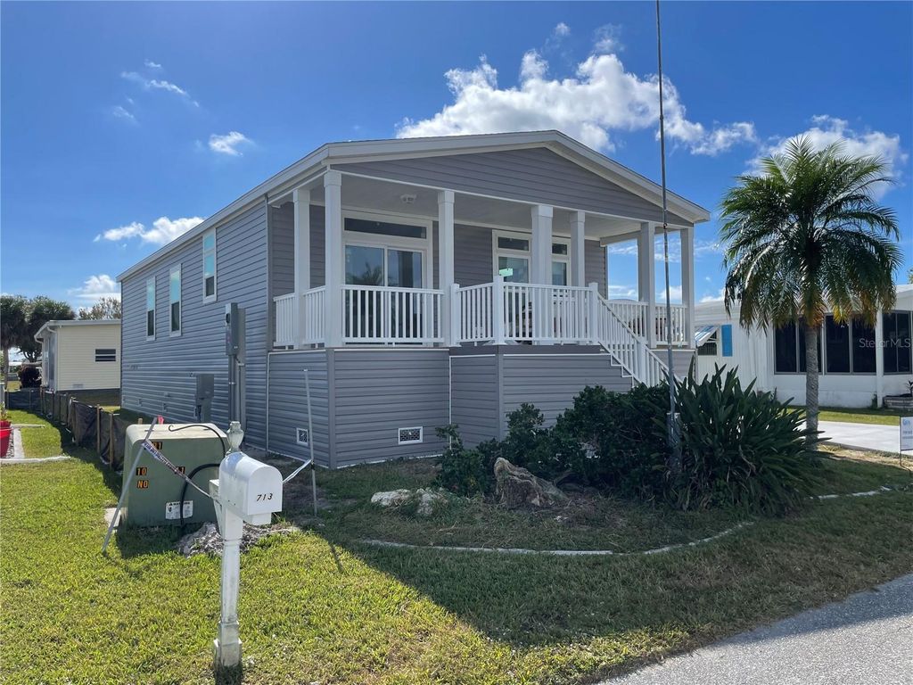 Photo of 715 Blackburn Blvd, North Port, FL 34287 (MLS # C7518084)