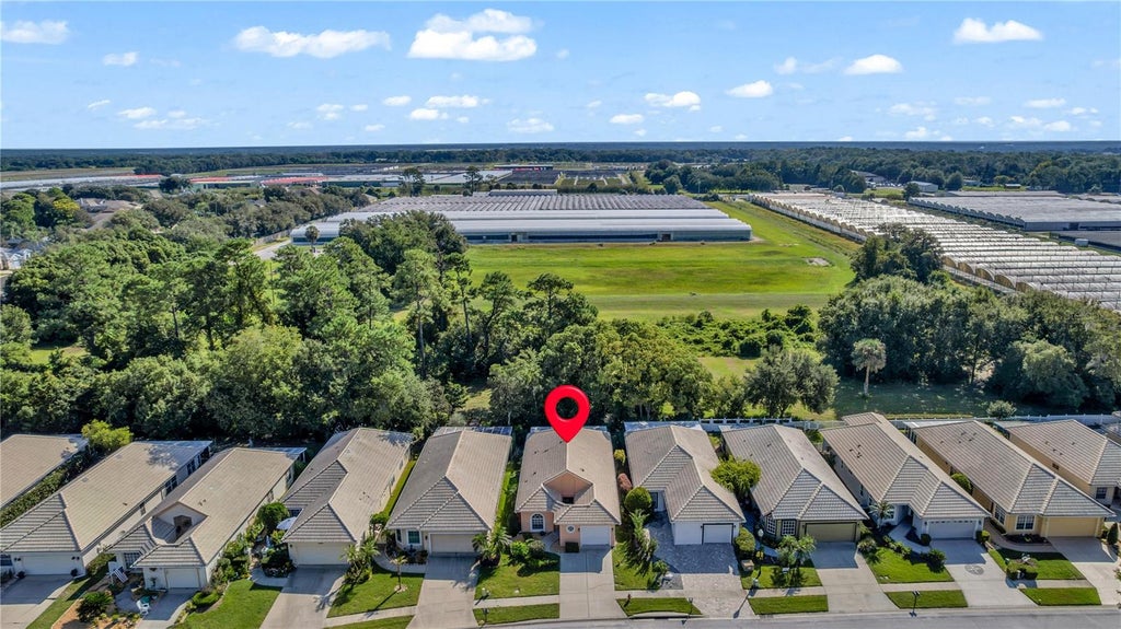 Photo of 8023 Saint Andrews Way, Mount Dora, FL 32757 (MLS # O6448616)