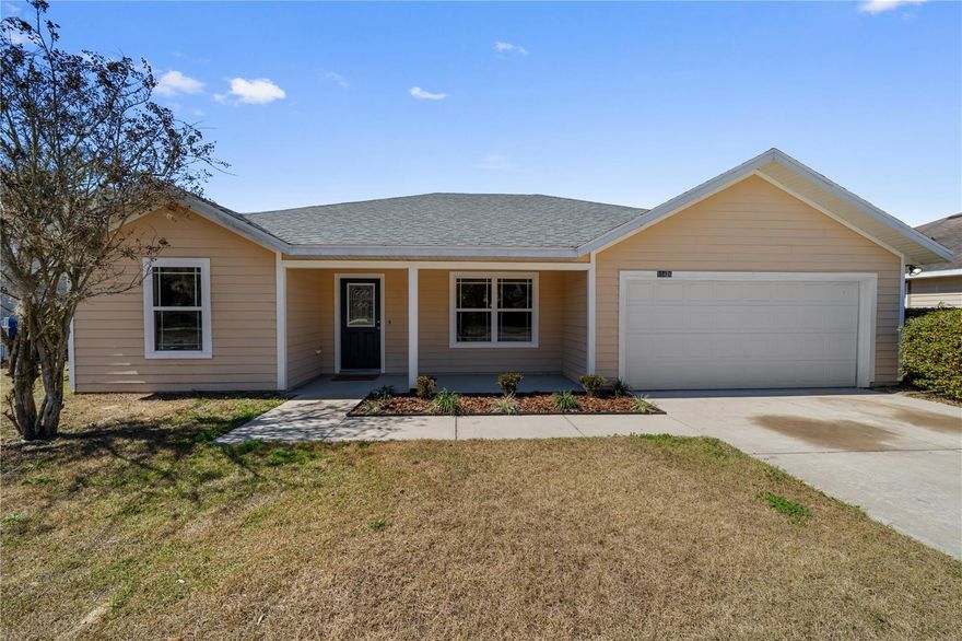 This charming 4 bedroom 2 bath split floor plan home backs up to green space that you can peacefully take in from the covered porch of your fenced in backyard. It has been recently renovated w/ new flooring, appliances, paint, water heater, and the roof & HVAC were replaced in 2022 for your peace of mind. It comes fully equipped w/ all kitchen appliances, washer & dryer, blinds & ceilings fans so there’s nothing left to do but move in. The community has underground electric, sidewalks & street lights, and the lowest HoA fees around at $75/year, walking distance to schools, shops & restaurants, and all that the quaint historic downtown Alachua has to offer. Come see all this home has to offer today!