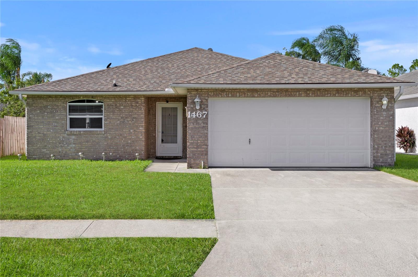 Tucked away on a quiet cul-de-sac in one of Port Orange's most desirable neighborhoods, this 3-bedroom, 2-bath home offers over 1,600 square feet of beautifully maintained living space on a high-and-dry lot—no flood worries here. Zoned for top-rated schools and just minutes from the area's best shopping and dining, the location is as convenient as it is charming. Inside, you'll find soaring ceilings and an open, airy floor plan. The upgraded kitchen features granite countertops, stainless steel appliances, and an eat-in dining area that flows into the spacious living room, where a cozy fireplace serves as the perfect focal point. Enjoy generously sized bedrooms, including a large primary suite, plus a 2-car garage for added storage and convenience. Step out back to a peaceful lake view—an ideal setting for morning coffee or evening relaxation. With a 2020 roof already in place, this home is truly move-in ready and waiting for its next chapter.