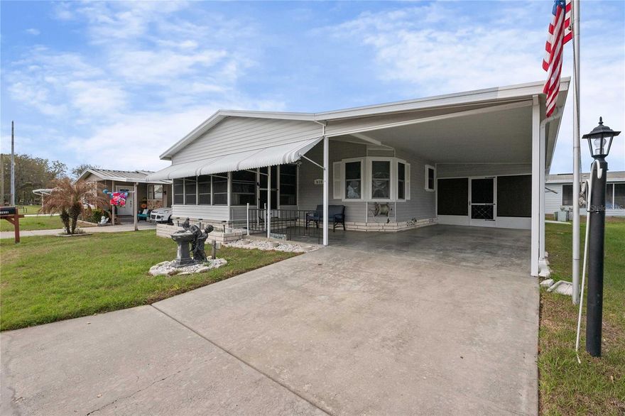 Welcome to 7039 Siesta Avenue in Spanish Trails West, a welcoming 55+ community in Zephyrhills, Florida. This beautifully updated Jacobsen home is being sold fully furnished with brand-new furnishings that have never been used, offering a truly move-in-ready opportunity to enjoy Florida living at its finest.  Step inside and you’re greeted by a thoughtfully designed kitchen that is truly a chef’s dream. The space features rich wood cabinetry with soft-close drawers, elegant granite countertops, a subway tile backsplash, updated hardware and lighting, and stainless-steel appliances—all combining to create a contemporary and polished look. Just off the kitchen, the dining area provides the perfect setting for everyday meals while also offering a welcoming space to gather with family and friends.  The spacious living room flows seamlessly from the dining area and provides a comfortable setting for both everyday living and entertaining. Filled with abundant natural light and an open, airy feel, this inviting space easily becomes the heart of the home.  Privately located at the rear of the home, the generously sized primary suite overlooks the tranquil pond and comfortably accommodates a king-size bed with room for additional furnishings, creating a peaceful and relaxing retreat. The suite also features a large walk-in closet and an elegantly updated ensuite bath complete with a walk-in DreamLine shower with a glass door and an oversized double-sink vanity topped with granite—creating a spa-like atmosphere right at home.  The guest bedroom comfortably accommodates a queen-size bed and features a spacious walk-in closet, making it ideal for visitors. Just across the hall, the guest bathroom has been beautifully updated with a stylish gray vanity, new tub, and Durawall surround with rain shower—providing a comfortable and private retreat for guests enjoying their time in the Florida sunshine.  Additional interior features include vaulted ceilings, updated lighting, luxury vinyl and vinyl tile-style flooring, inside laundry, and a bright 13 x 10 Florida room at the front of the home—perfect for relaxing and enjoying the outdoors from the comfort of inside.  Outside, you’ll enjoy stunning views of the community pond and its flowing fountain, along with a patio overlooking the water—an ideal spot to relax and unwind. The home also includes a 2020 A/C with heat pump, 2024 hot water heater, durable metal roof-over, new water filtration system, screened room just off the carport, and an attached workshop area for hobbies or additional storage.  Spanish Trails West offers an exceptional lifestyle with amenities that include a pool, clubhouse, tennis courts, pickleball, six enclosed shuffleboard courts, an active travel club, and RV/trailer parking. The low monthly HOA fee of $142 covers lawn care, trash service, cable, and internet—adding to the incredible value this community provides.  For those who appreciate comfort, quality, and a vibrant community atmosphere, this home presents a rare opportunity to enjoy the very best of Florida living.  Schedule your private showing today and experience the Spanish Trails West lifestyle—where comfort, convenience, and community come together beautifully.