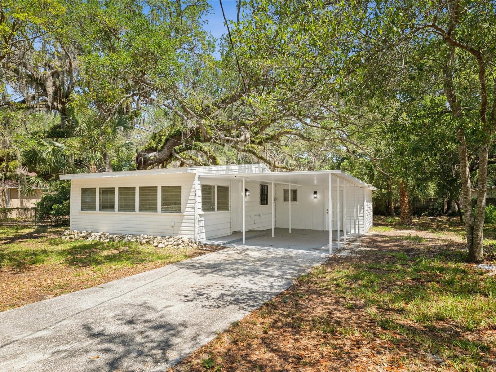 Welcome to your stunning new oasis nestled in the heart of Hudson, Florida! This beautifully updated 3-bedroom, 1-bathroom home is a perfect blend of modern convenience and classic charm. As you approach, you'll be captivated by the fresh exterior paint that perfectly complements the bright and inviting atmosphere. Step inside to discover an open-concept layout adorned with brand-new flooring that flows seamlessly through each room. The spacious living area welcomes you with abundant natural light, making it the ideal space for relaxation or entertaining guests. As you continue your tour, you'll be delighted by the seamless transition from the living area to the dining space, perfect for hosting dinner parties or family gatherings. The thoughtfully designed layout ensures that every inch of the home feels connected and inviting. Each room flows effortlessly into the next, creating a harmonious environment that is both functional and aesthetically pleasing.
Prepare to fall in love with your brand-new kitchen featuring contemporary finishes, new appliances, and ample counter space for all your culinary adventures. This kitchen makes it easy to host, no matter the occasion. Retreat to your serene bedrooms where comfort meets style. Each room is freshly painted and offers plenty of closet space while providing a peaceful haven for unwinding after a long day. The newly renovated bathroom boasts modern fixtures and tasteful design elements. Located near beaches and shopping centers and with quick access to major highways and interstates, this home is not going to last long. Be sure to schedule an appointment today!
