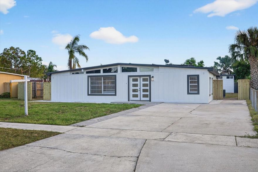 STUNNING FULL REMODEL of this 5 Bedroom 3 Bath Home located in the highly desirable Gandy-Sun Bay South corridor in Tampa.  Step inside to discover an inviting open floor plan featuring modern finishes, updates galore, and a sleek, contemporary kitchen with quartz countertops and stainless steel appliances.  New Plumbing, A/C, Electric, and two new tankless water heaters.  HUGE Master bedroom/ closet combo, along with large guests bedrooms with the option for an office or 5th bedroom.  Enjoy outdoor living at its best in the peaceful, fully fenced backyard — perfect for relaxing, entertaining, or letting pets play freely. Plenty of room to add a Pool for additional outdoor enjoyment.  Located just minutes from MacDill AFB, the Gandy Bridge, and South Tampa’s best dining and shopping, this move-in-ready home combines comfort, convenience, and style.