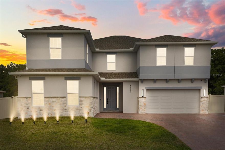 Welcome to 5867 Sierra Crown Street, a beautifully upgraded and meticulously maintained home located in the desirable and growing community of Mount Dora. This move-in ready residence offers a modern open-concept layout designed for both comfort and functionality, featuring multiple living spaces filled with natural light, high ceilings, and a seamless flow perfect for everyday living and entertaining.
The heart of the home is the extended, fully upgraded kitchen, showcasing additional cabinetry, elegant quartz countertops, and a spacious center island that opens effortlessly to the living and dining areas—ideal for hosting gatherings or enjoying quiet evenings at home. Additional custom quartz surfaces in the loft and laundry room further elevate both style and functionality. This home has been thoughtfully enhanced with luxury vinyl flooring throughout, including the garage, and freshly painted interiors that create a clean, modern aesthetic. All bathrooms have been upgraded with sleek stand-up showers and feature six newly installed smart toilets, adding a touch of luxury and convenience.
Designed with both comfort and efficiency in mind, the home includes a whole-house water filtration system, alkaline water connection for the refrigerator, and a professionally installed split A/C system in the garage—perfect for a home gym, workspace, or additional flex area. A built-in mudroom provides practical storage for everyday organization. Technology and security are seamlessly integrated with a full camera system (no monthly fees) and dual Wi-Fi access points for strong connectivity throughout both levels of the home. Enhanced interior and exterior white lighting creates a bright, modern ambiance day and night. Step outside to enjoy an oversized fully fenced backyard with a screened-in terrace, offering the perfect space for relaxing or entertaining year-round. The extended front paver driveway provides additional parking, complementing the home’s already spacious two-car garage. Conveniently located near major roadways, shopping, dining, and the charm of historic downtown Mount Dora, this property offers the perfect blend of suburban tranquility and everyday convenience.
With extensive upgrades, modern finishes, and true move-in ready condition, this home is a rare opportunity you don’t want to miss. Schedule your private showing today!