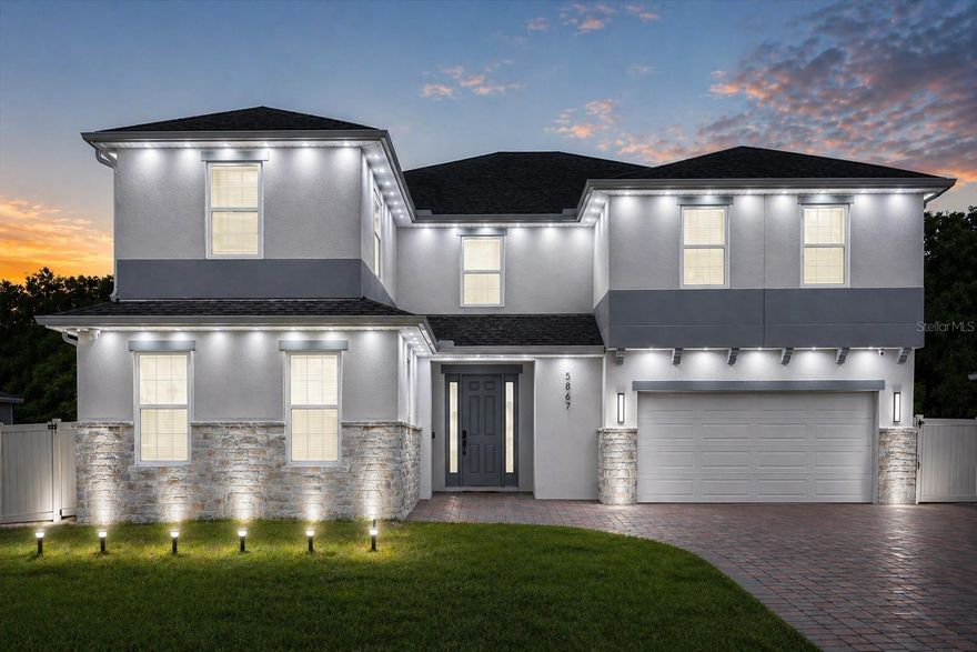 Welcome to 5867 Sierra Crown Street, a beautifully upgraded and meticulously maintained home located in the desirable and growing community of Mount Dora. This move-in ready residence offers a modern open-concept layout designed for both comfort and functionality, featuring multiple living spaces filled with natural light, high ceilings, and a seamless flow perfect for everyday living and entertaining.
The heart of the home is the extended, fully upgraded kitchen, showcasing additional cabinetry, elegant quartz countertops, and a spacious center island that opens effortlessly to the living and dining areas—ideal for hosting gatherings or enjoying quiet evenings at home. Additional custom quartz surfaces in the loft and laundry room further elevate both style and functionality. A standout feature of this home is the private mother-in-law suite, complete with its own walk-in closet, a convenient kitchenette, and a full bathroom—perfect for multi-generational living, guests, or even potential rental flexibility. This home has been thoughtfully enhanced with luxury vinyl flooring throughout, including the garage, and freshly painted interiors that create a clean, modern aesthetic. All bathrooms have been upgraded with sleek stand-up showers and feature six newly installed smart toilets, adding a touch of luxury and convenience.
Designed with both comfort and efficiency in mind, the home includes a whole-house water filtration system, alkaline water connection for the refrigerator, and a professionally installed split A/C system in the garage—perfect for a home gym, workspace, or additional flex area. A built-in mudroom provides practical storage for everyday organization. Technology and security are seamlessly integrated with a full camera system (no monthly fees) and dual Wi-Fi access points for strong connectivity throughout both levels of the home. Enhanced interior and exterior white lighting creates a bright, modern ambiance day and night. Step outside to enjoy an oversized fully fenced backyard with a screened-in terrace, offering the perfect space for relaxing or entertaining year-round. The extended front paver driveway provides additional parking, complementing the home’s already spacious two-car garage. Conveniently located near major roadways, shopping, dining, and the charm of historic downtown Mount Dora, this property offers the perfect blend of suburban tranquility and everyday convenience.
With extensive upgrades, modern finishes, and true move-in ready condition, this home is a rare opportunity you don’t want to miss. Schedule your private showing today!