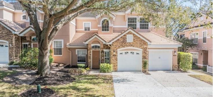 Welcome to this beautifully renovated condo in the desirable Phillips Bay community of Dr. Phillips. Featuring an open floor plan with updated kitchen, bathrooms, flooring, windows, and staircase, this light-filled home offers a spacious primary suite with walk-in closet, additional storage, and the convenience of an attached garage. Enjoy peaceful wooded views and resort-style amenities including a pool, spa, fitness center, and clubhouse. Perfectly located just minutes from top dining, shopping, theme parks, golf, and with easy access to I-4, 408, the Turnpike, and Downtown Orlando, this condo combines modern comfort with unbeatable convenience.