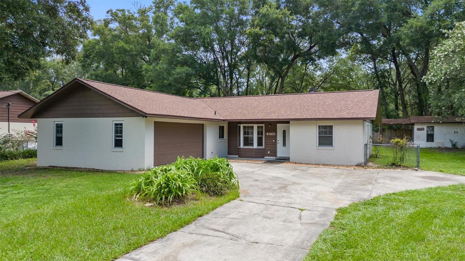 Welcome to your dream one story pool home in the heart of beautiful Ocala. Situated on a spacious 0.27-acre lot, this thoughtfully updated 3-bedroom, 2-bathroom residence offers the perfect blend of comfort, character, and modern style. Step inside to a bright and open floor plan featuring a spacious living room with a charming bay window and a wood-burning fireplace, creating a warm and inviting space to relax or entertain. The dedicated dining area opens to the backyard through elegant French doors, making indoor-outdoor living effortless. The remodeled kitchen is a chef’s delight, boasting stainless steel appliances, light cabinetry, and a stylish backsplash. Three generously sized bedrooms provide comfort and privacy, including a primary suite with a large walk-in closet. Step outside to your private oasis, where you can enjoy peaceful mornings or lively gatherings on the screened patio or by the sparkling pool. Recent updates include new flooring in the main living area in 2025, a new roof in 2023, and a new water heater in 2024, offering peace of mind for years to come. With its ideal layout, charming details, and excellent location, this Ocala pool home is truly move-in ready. Schedule your private showing today and make it yours.