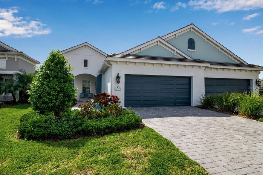 Better than new Neal-built villa—only four years young and nearly 2,000 sq feet loaded with over $75,000 in premium builder upgrades. This immaculate home features HURRICANE IMPACT WINDOWS/SLIDER, crown molding, elegant tile flooring, and stunning upgraded carpeting. Gourmet kitchen with spacious island, custom tile backsplash, natural gas range, upgraded cabinetry, stainless steel matching appliances with warranty, and alluring granite countertops. Open-concept great room and dining area offer an expansive layout ideal for entertaining with recessed LED lighting. Primary suite features dual vanities with quartz countertops, makeup vanity, double closets, and a spa-inspired walk-in shower. Two additional generously sized bedrooms provide flexibility for guests.  Impressive size Den/Study to work from home/extra living space. Guest bathroom with expansive vanity and shower/tub combo.  Off the kitchen find resourceful laundry room with cabinet and storage. Enjoy your private outdoor oasis on the extended screened lanai with gas hookup ready for an outdoor kitchen—perfect for relaxing or entertaining. Located in the highly sought-after gated Indigo community, residents enjoy access to the exclusive Indigo Oasis private pool for villa owners, Activities director with substantial calendar, plus a clubhouse with resort-style pool and cabanas, outdoor spa, 24-hour fitness center, bocce ball, pickleball courts, and playground. HOA takes your worries away by managing lawn/landscaping mowing and trimming, fertilizing, irrigation, mulch, and roof maintenance. Looking to make a second home - turnkey optional. Situated in Lakewood Ranch, the nation’s award-winning master-planned community, with convenient access to shopping, dining, A-rated schools, beaches, professional sports/entertainment. Elevated, stylish, and move-in ready—this villa offers the best of luxury Florida living.