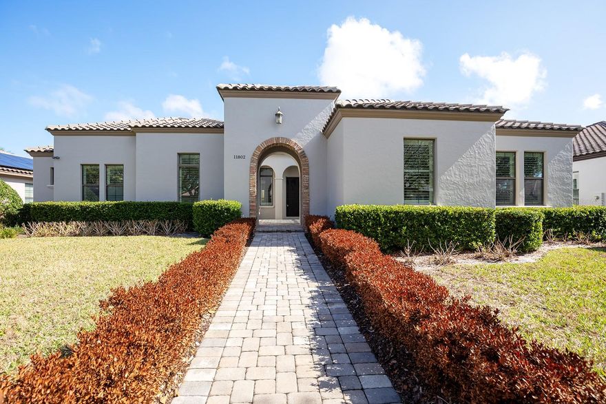 Stunning Mediterranean courtyard-style estate offering 4 bedrooms, 4.5 Bathrooms and 3396 sq ft of living space--all thoughtfully designed on one spacious level by Siliman Homes! From the moment you enter, you'll appreciate the seamless indoor-outdoor flow, centered around a salt water pool, cabana and expansive brick paver patio--perfect for entertaining or enjoying Florida living all year round. The open concept kitchen opens effortlessly to the entire family room, where you'll enjoy a Cosmos gas fireplace and surround sound. Elegant travertine flooring runs throughout the main living areas, with engineered wood flooring in the master bedroom and plush carpeting in the secondary bedrooms. The 4th bedroom functions beautifully as a private IN-LAW suite, complete with its own separate entrance, living room, full bedroom and full bathroom--ideal for MULTI-GENERATIONAL living or guests.  This residence also features throughout upgrades including tankless water heater, open-cell foam spray insulation, natural gas 5 burner stove, Low-E insulated glass windows and sliding doors! Located in a guard gated community Waterstone, known for its mature landscaping and privacy, the home is located within 10 mins to the Publix Shopping center and dining.  Residents also enjoy PRIVATE ACCESS into Windermere Prep School! This is a rare opportunity to own in one of the area's most desirable gated communities!