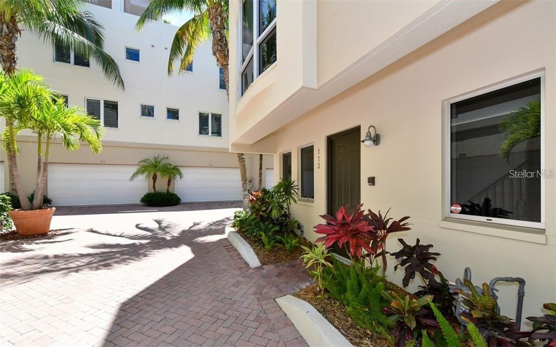 Live, Work and Play in this rarely available, 3bd/4.5 bath one-of-a-kind corner unit which boasts over 2,400 sq ft of Sarasota luxury, total area 3,080 sq ft. Enjoy downtown city views from this updated 4 story move in condition townhouse. recently painted top to bottom, security system, 3 separate zoned A/C units and instant hot water system. The first level hosts an attached two-car garage with plenty of overhead storage which leads into the foyer w/small bedroom and European bathroom. Guests are presented with the option of either riding your private elevator or accessing the wooden staircase as they make their way towards the 2nd level. The 2nd floor has a large open gourmet kitchen w/breakfast bar. Complemented by beautiful granite countertops & stainless-steel appliances, family room, formal dining area and half bathroom. The third level is reserved for the alluring master suite and the 2nd bedroom, both with walk-in closets and private bathrooms. Continuing up the elevator or winding spiral staircase to the 4th and final level, behold a spacious bonus room with wet bar, small refrigerator and enclosed washer/dryer. The floor to ceiling windows invites guests out to the magnificent city views. There is also a small outside open area on the top floor, great for plants or even sunning yourself. Amenities include, gated community, heated swimming pool/spa, new gym with top-of-the-line equipment. Main Street is nearby to indulge in the area's finest dining, shopping or catch a show. Don't miss the opportunity to live in the heart of Sarasota's vibrant downtown! Easy to show.