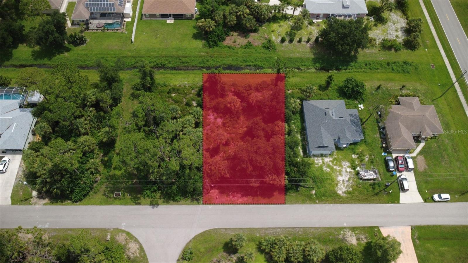 Welcome to Cover Lane in beautiful North Port, Florida, where opportunity meets location in one of the region’s most rapidly growing residential communities. This prime vacant lot offers an exceptional canvas for you to build your dream home or investment property. Tucked away on a quiet paved street and surrounded by well-maintained single-family homes, the lot boasts a serene and private atmosphere while remaining close to all the modern conveniences of city living. The lot is naturally wooded, giving you the flexibility to preserve mature trees for shade and privacy or to clear the space entirely to suit your design vision. With no HOA restrictions and no CDD fees, you'll have the freedom to customize your home to reflect your personal style and preferences without limitation.
One of the standout features of this location is the peaceful greenbelt that runs behind the property, offering added privacy and a tranquil buffer between you and your rear neighbors. Just imagine relaxing in your backyard with no one directly behind you. Whether you're a builder looking for your next project or a homeowner seeking a location to construct a personal sanctuary, this lot delivers unmatched potential in a thriving neighborhood.
North Port is a vibrant and growing city known for its natural beauty, community feel, and convenient location. Enjoy easy access to I-75 for commuting or weekend getaways, while still being just a short drive from the best of Southwest Florida. Nearby attractions include the North Port Aquatic Center with water slides and a lazy river, the scenic Myakkahatchee Creek Environmental Park for hiking and wildlife observation, and the famous Warm Mineral Springs Park for a relaxing dip in healing waters. You’ll also be just a short distance from the new Wellen Park development and CoolToday Park, the spring training home of the Atlanta Braves, offering year-round events, live music, and family-friendly fun.
For your daily needs, you'll find everything close by. Grocery stores, pharmacies, banks, and retail shopping options are just minutes away. Dining options in the area range from local favorites like Blue Tequila Mexican Restaurant & Cantina and Olde World Restaurant to national chains and cozy cafés perfect for weekend brunches or takeout nights. Excellent medical facilities, including the nearby Sarasota Memorial Hospital – Venice Campus and ShorePoint Health Port Charlotte, provide peace of mind for residents of all ages. Families will appreciate access to top-rated public and charter schools, while outdoor enthusiasts will enjoy the many parks, golf courses, and waterways that make North Port an ideal place to call home.
Whether you’re building for yourself, planning your retirement, or investing in a highly desirable area, this lot offers the ideal combination of space, flexibility, and location. Come explore the possibilities on Cover Lane and see why North Port is one of the fastest growing and most loved cities on Florida’s Gulf Coast.