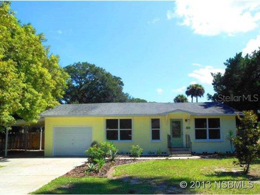 Beautifully remodeled and super-clean 2 BR home on quiet half-acre centrally located between world-class inshore fishing to the south in Mosquito Lagoon and world-class beaches and surfing just to the north in New Smyrna Beach. Built in 1959, this home was thoroughly remodeled by a contractor in 2006, including new AC, roof, kitchen, insulation, most windows, and bathroom, and beautifully restoring the real oak hardwood floor. The open floor plan is bright and spacious, with practically a wall of windows around it, plus a light tunnel. The very large back yard is fenced with ample room for RV or boat parking - or just about any outdoor activity or usage imaginable. This home has an old-Florida, country living feel while being thoroughly upgraded and conveniently located near shopping and more. ;Water: City