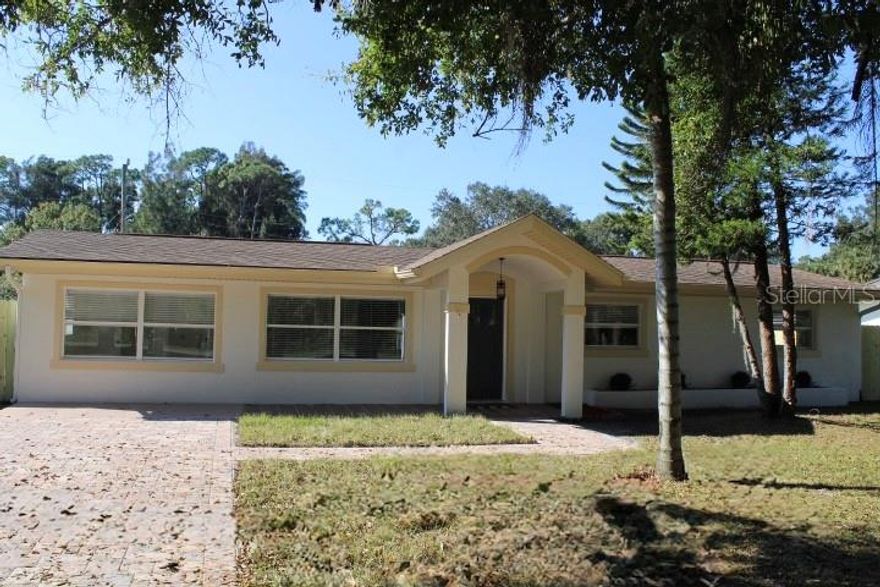 JUST REDUCED!!! A beautifully updated ranch-style home that blends modern finishes with everyday comfort. Step inside to discover brand-new LVT flooring, fresh interior paint, and upgraded doors and trim that elevate every space. The renovated kitchen is a standout, featuring soft-close shaker cabinets, elegant quartz countertops, and new Bespoke appliances—perfect for both cooking and entertaining. The bathroom has also been fully updated with contemporary finishes and LED mirrors for a modern touch. Enjoy cozy evenings near the stunning chimney, and appreciate the ambiance created by new light fixtures and LED ceiling fans throughout. An added bonus is the enclosed porch, offering a versatile space ideal for relaxing, entertaining, or enjoying the outdoors year-round. Outside, the home shines with fresh exterior paint, a brand-new paver driveway, and a fully fenced yard, all nestled in a peaceful and private setting. With no HOA, you have the freedom to make this home truly your own. Located within a highly sought-after school district and just minutes from shopping, dining, parks, and I-95, this turnkey ranch home offers both convenience and tranquility. Modern, stylish, and move-in ready — 2070 Seminole Blvd is the perfect place to call home. LA is owner