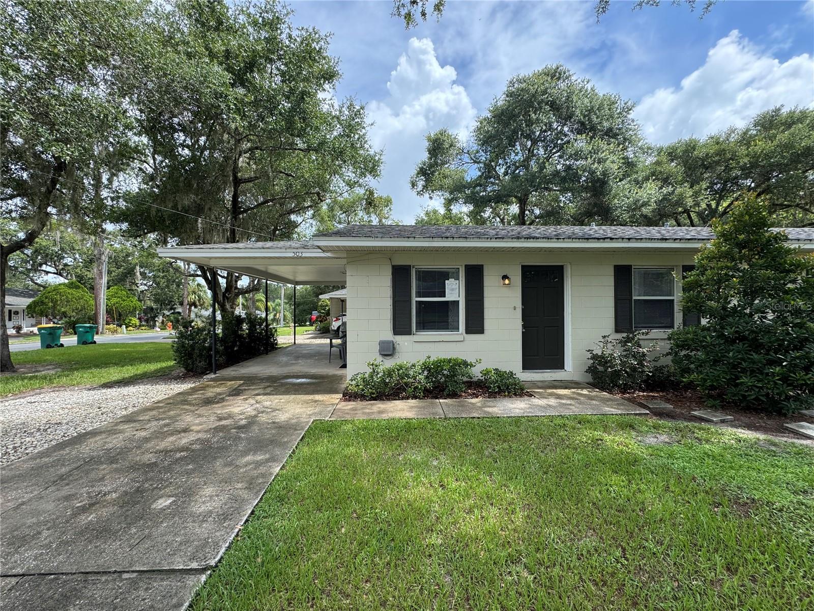 Perfectly located 2 bedroom, 1 bathroom duplex in Mount Dora! This home offers a nice kitchen with eat in area and open to the living room - naturally light and airy. The carport is a nice feature especially when a rain comes through, to protect your car. The property is a convenient walk to the park or boat ramp, and just minutes to downtown Mount Dora. It's a must see.